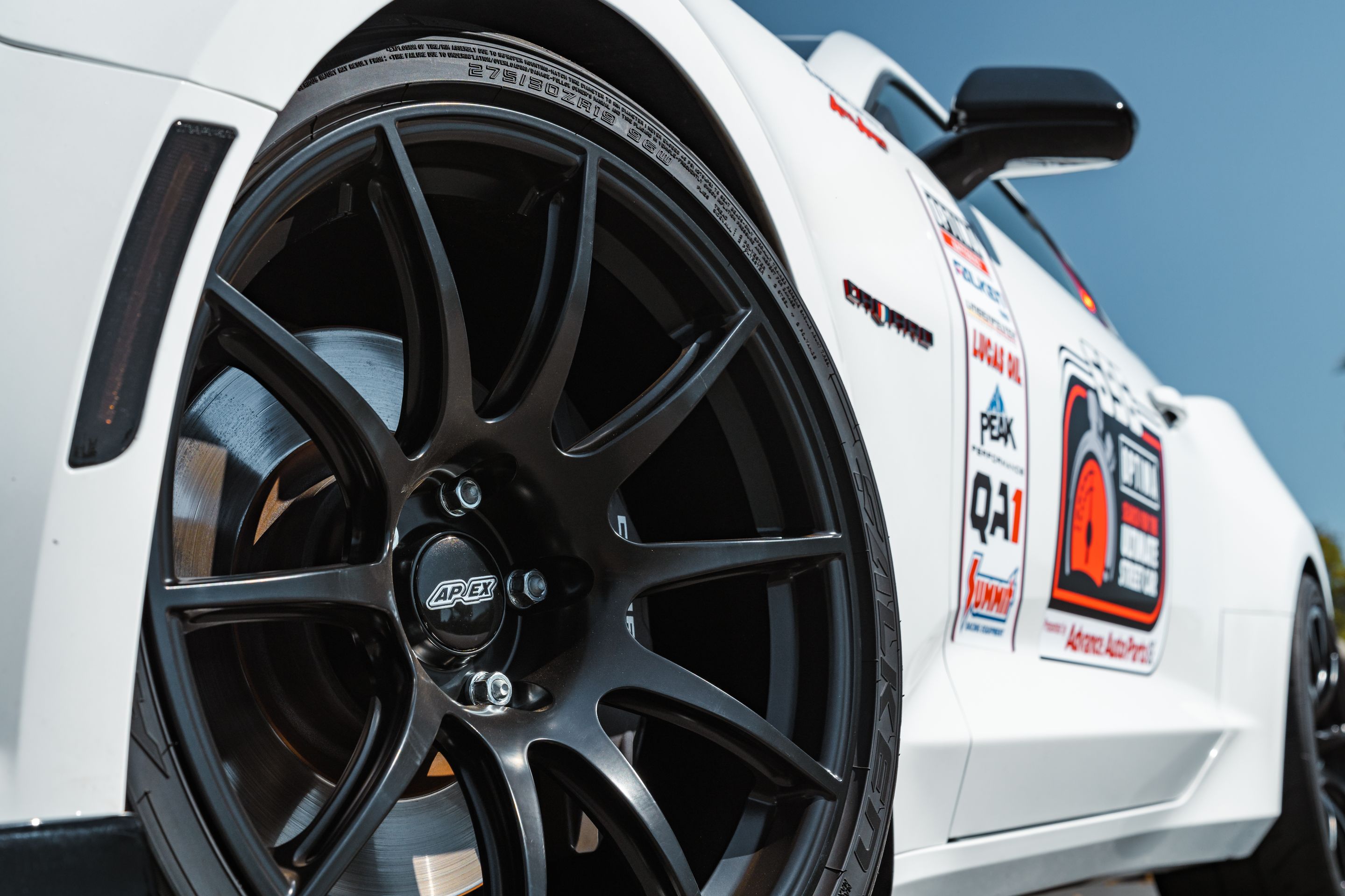 White Chevrolet 6th Gen Camaro SS with 19" SM-10 Apex wheels in Satin Black