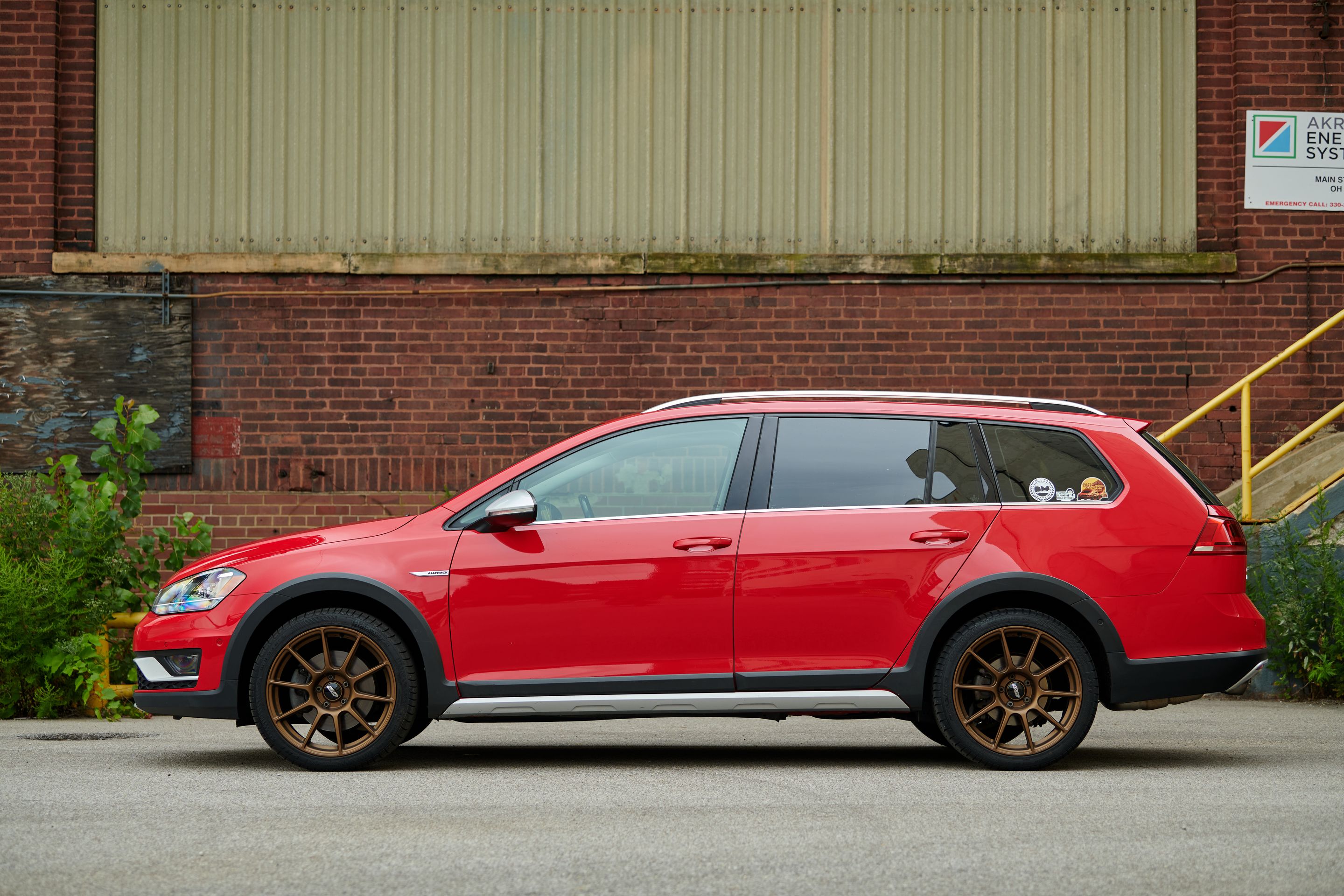 Red VW MK7 Alltrack/SportWagen Alltrack with 18" SM-10 Apex wheels in Satin Bronze