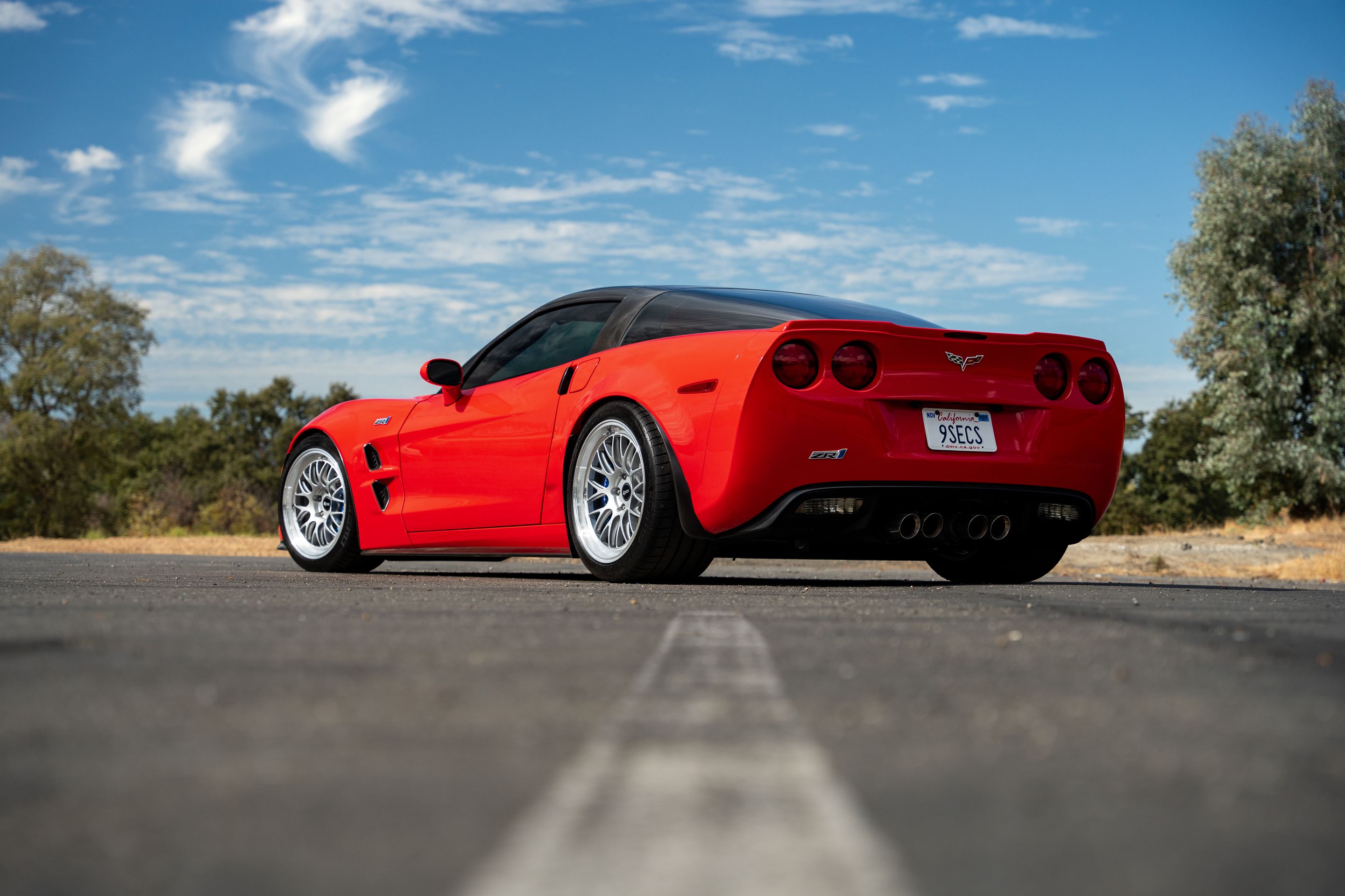 Red Chevrolet C6 Corvette ZR-1 with 18"/19" ML-10RT Apex wheels in Machined Lip Race Silver