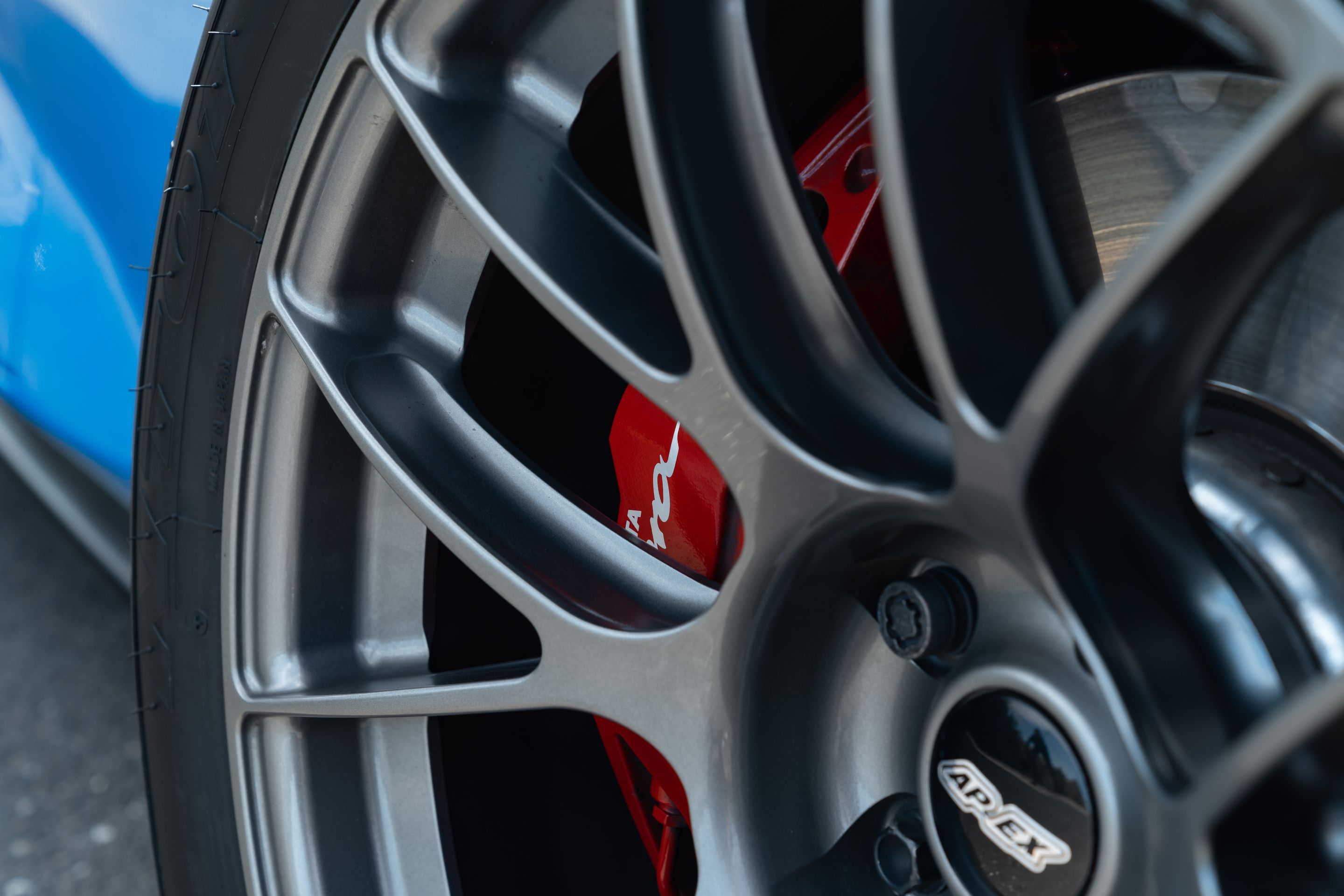 Blue Toyota GR Supra with 18" EC-7RS Apex wheels in Anthracite