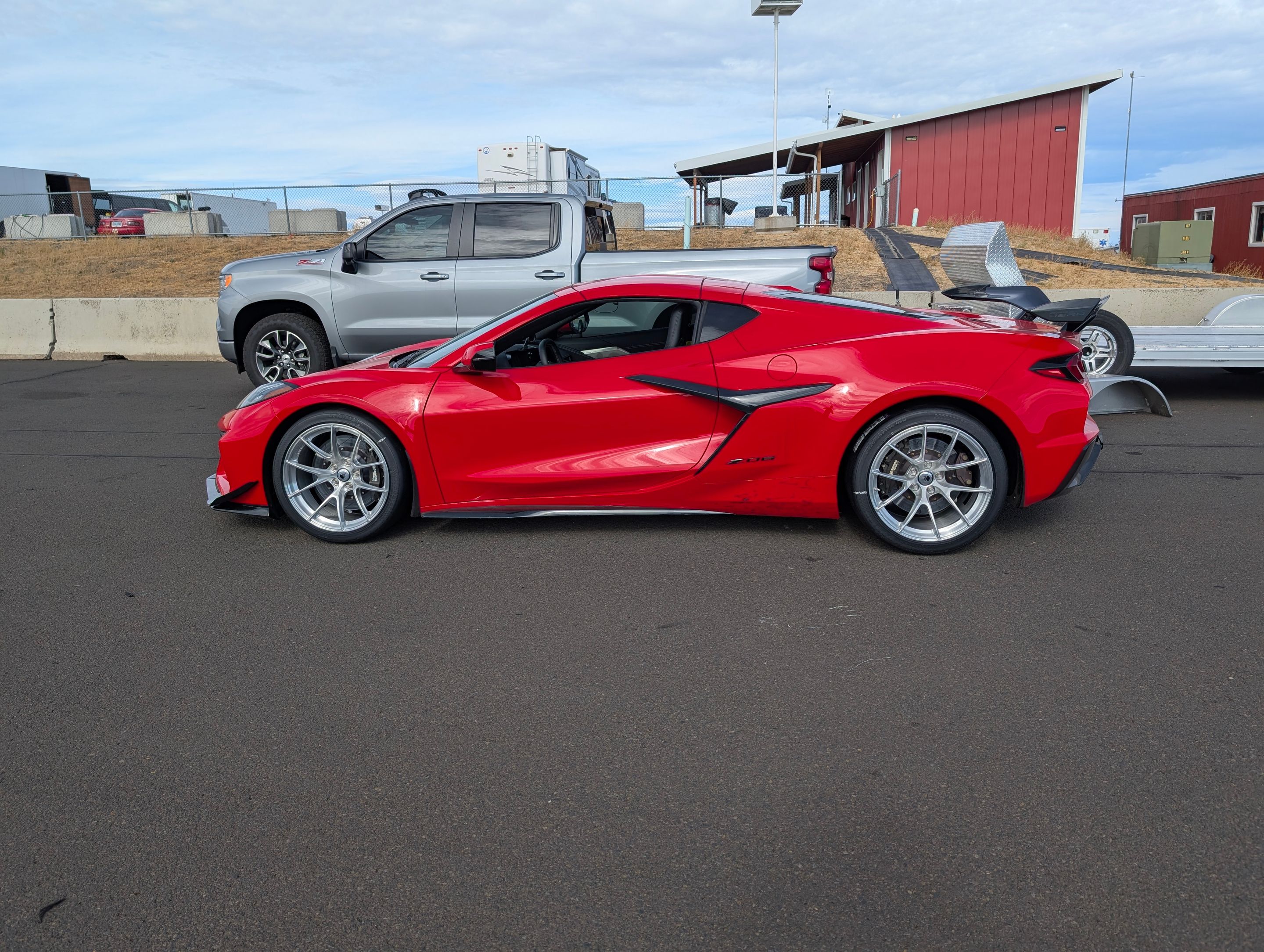 Red Chevrolet C8 Corvette Z06 with 19" VS-5RS Apex wheels in Brushed Clear