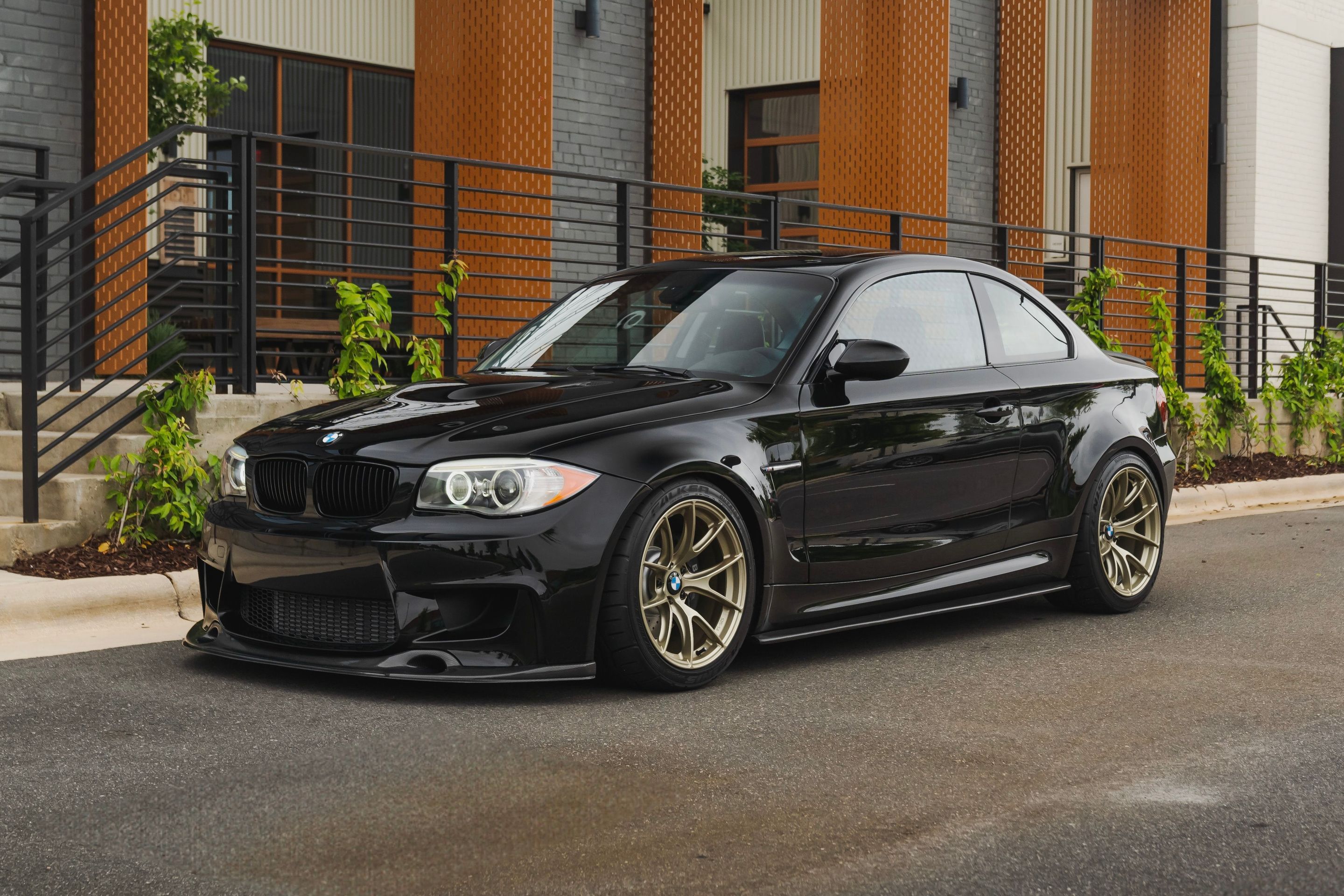 Black BMW E82 Coupe 1 Series with 18" VS-5RS Apex wheels in Motorsport Gold