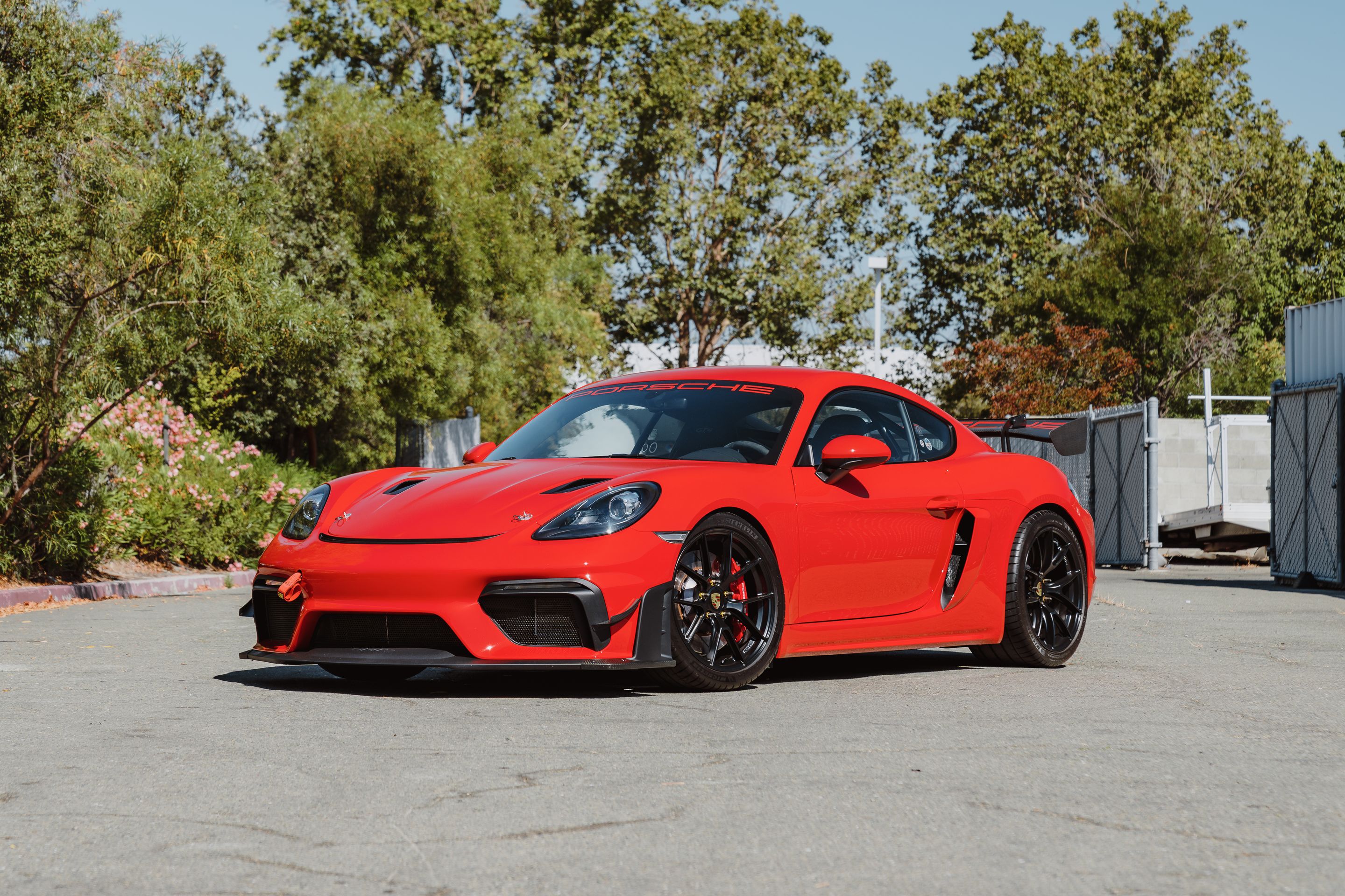 Red Porsche 718 Cayman GT4 with 19" VS-5RS Apex wheels in Satin Black