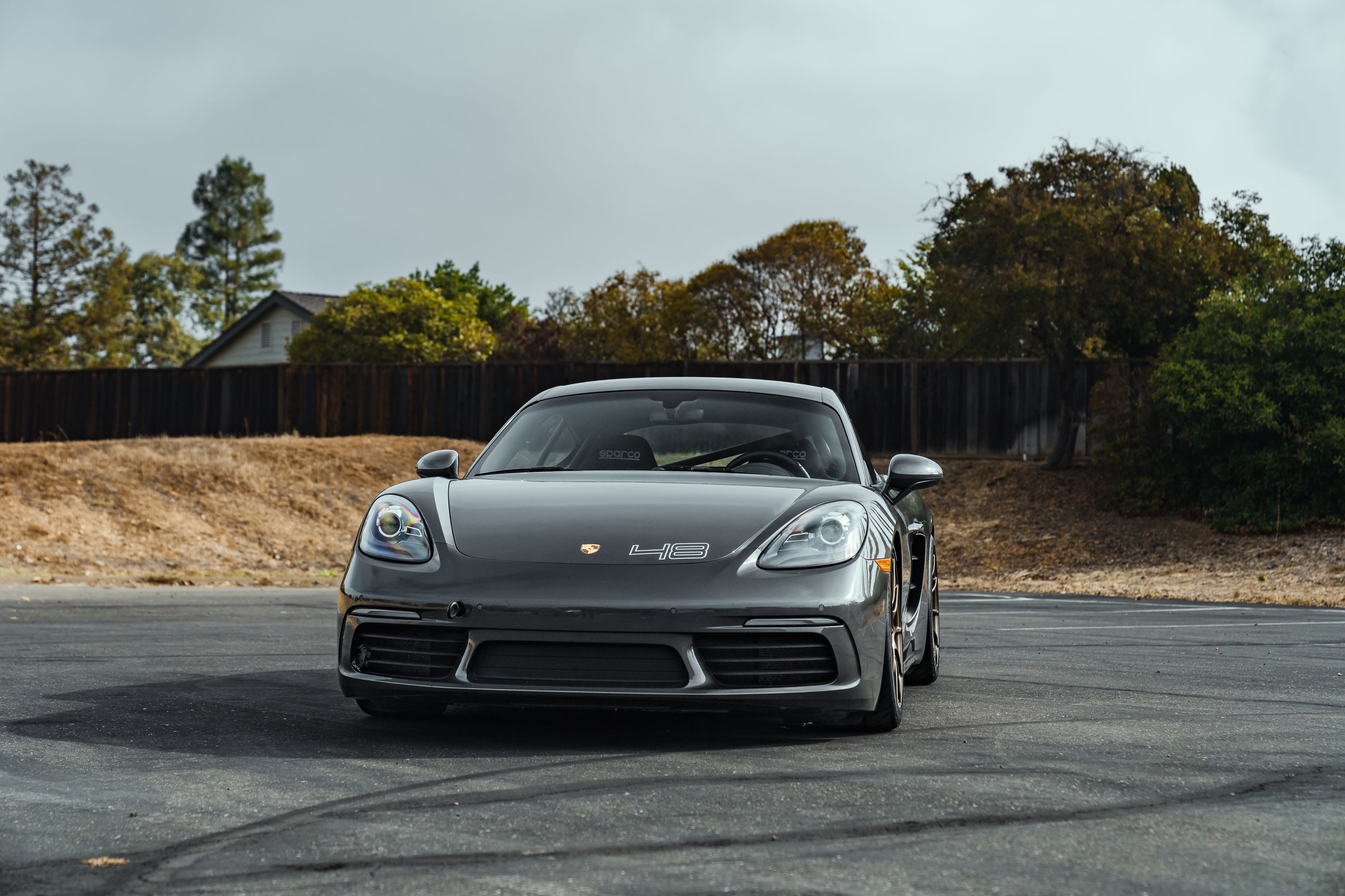 Grey Porsche 718 Cayman S with 19" SM-10RS Apex wheels in Satin Bronze