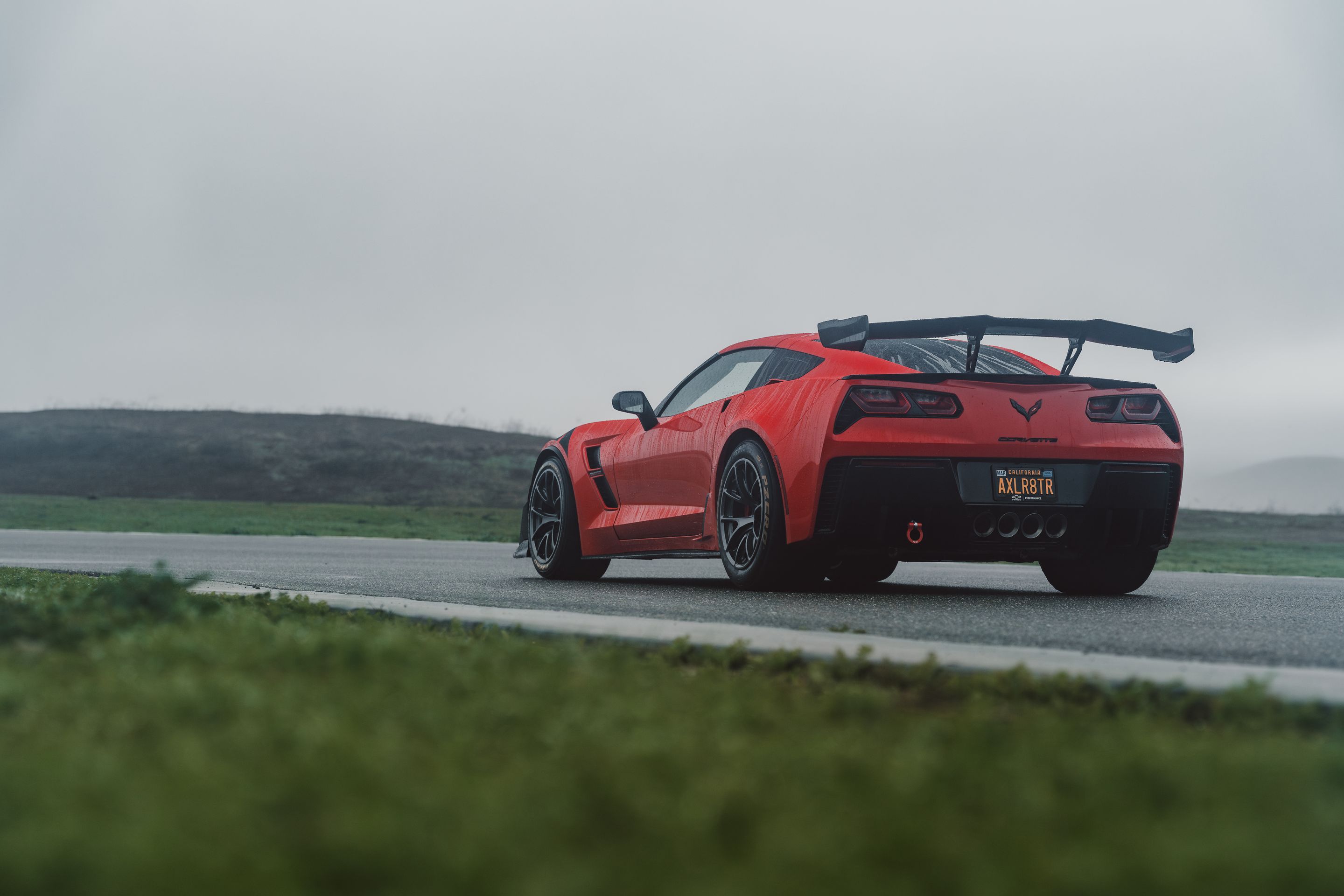 Red Chevrolet C7 Corvette Grand Sport with 18" VS-5RE Apex wheels in Anthracite