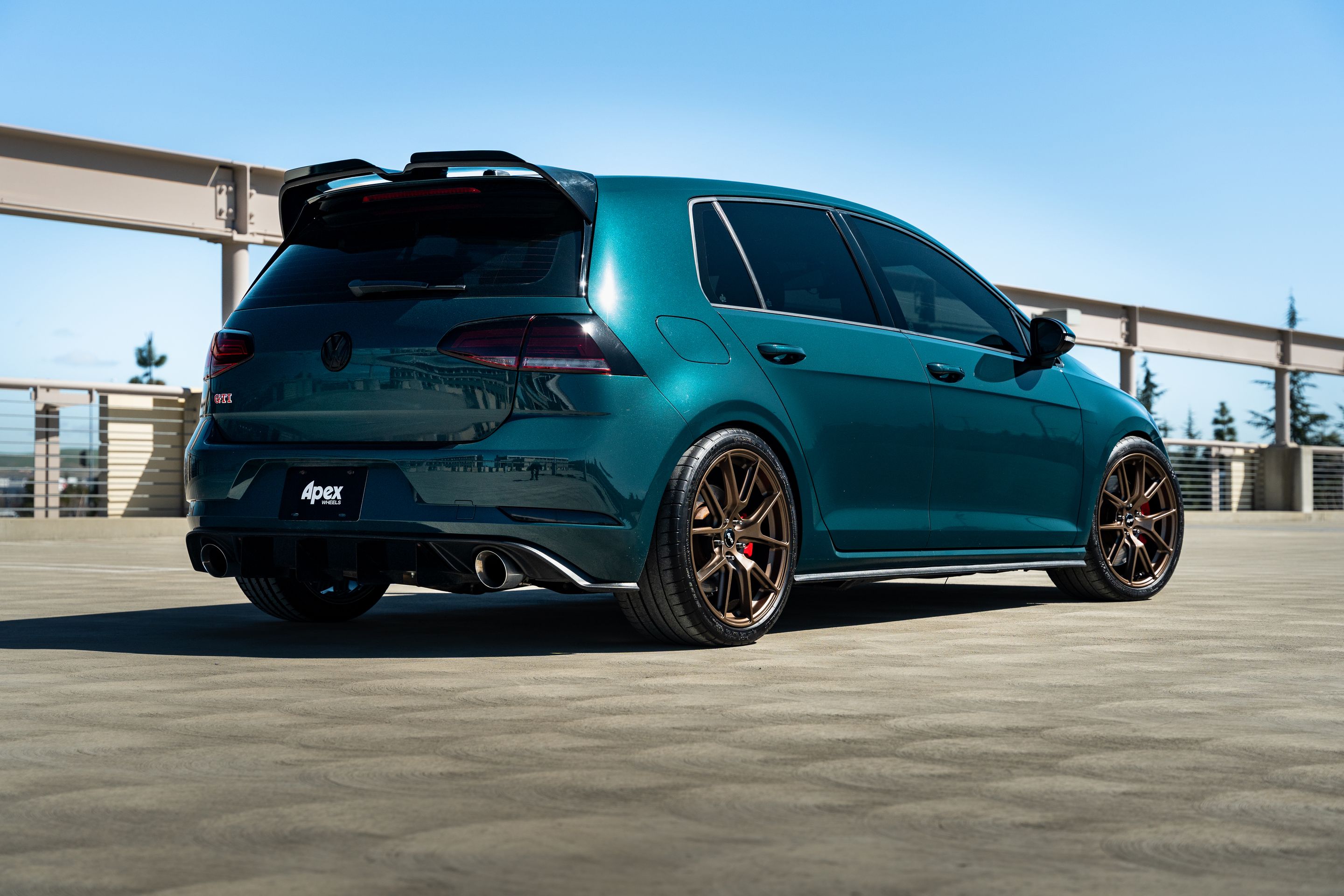 Green VW MK7 GTI with 18" VS-5 Apex wheels in Satin Bronze