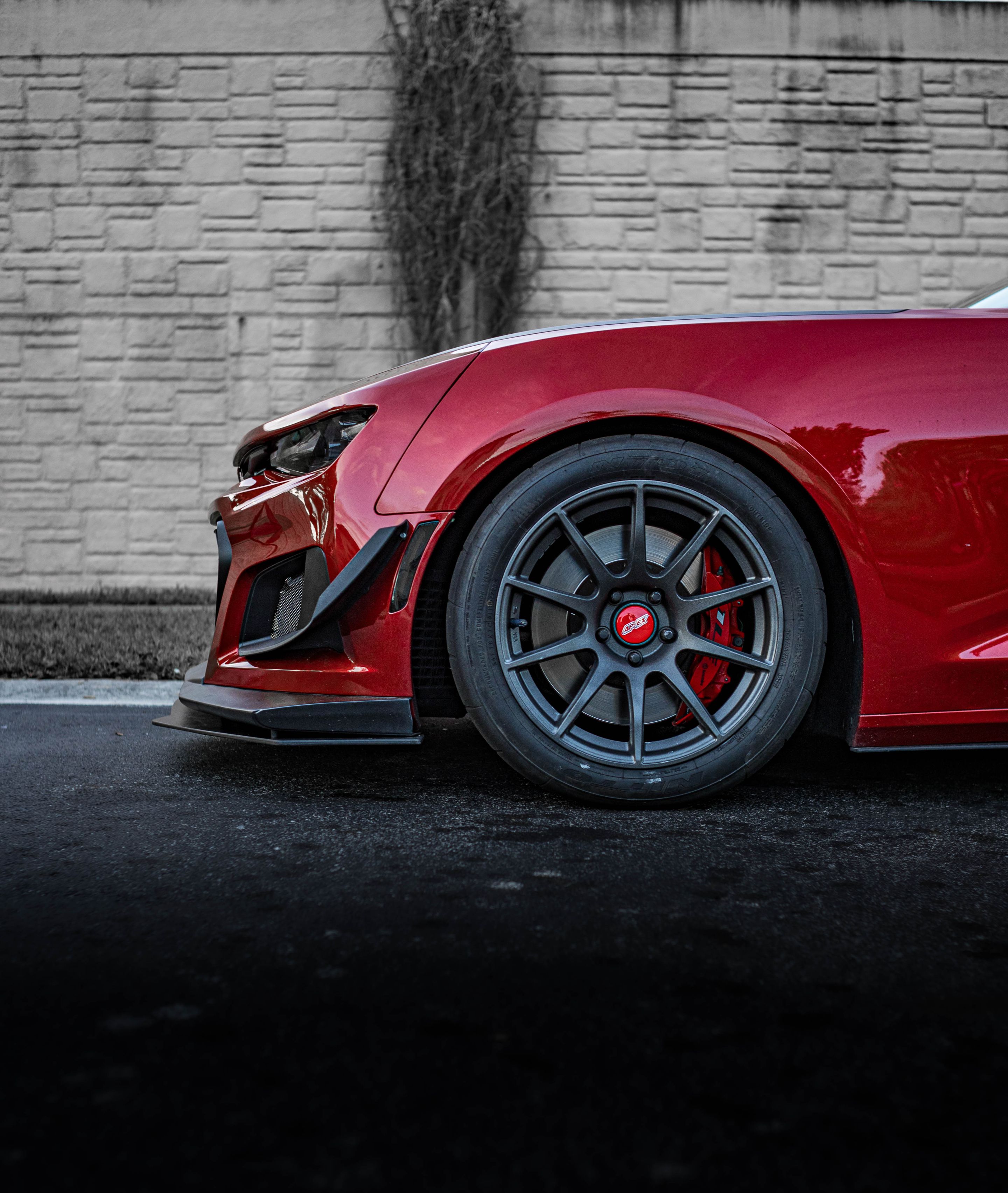 Red Chevrolet 6th Gen Camaro SS with 19" SM-10 Apex wheels in Satin Black