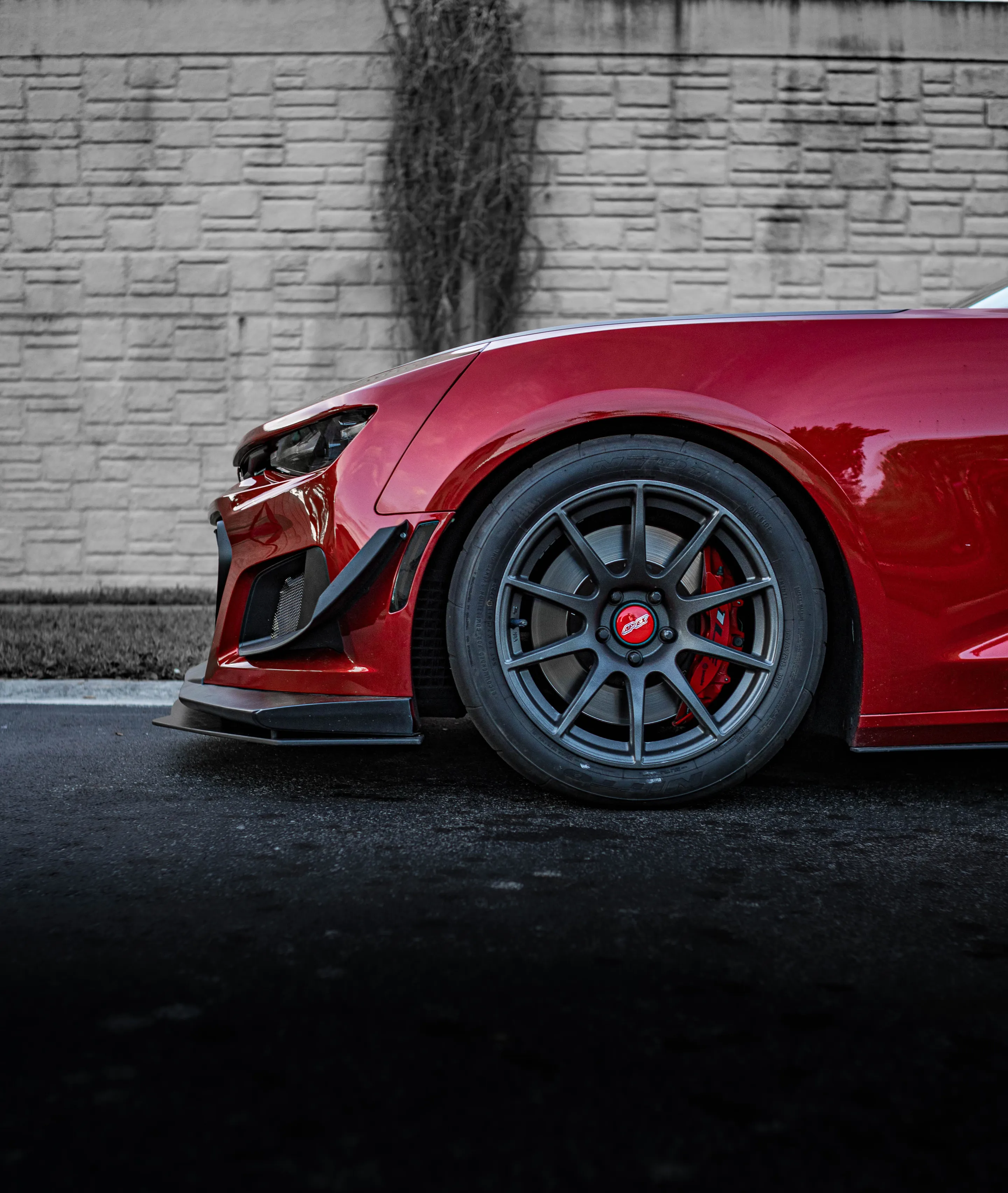 Red Chevrolet 6th Gen Camaro SS with 19" SM-10 Apex wheels in Satin Black