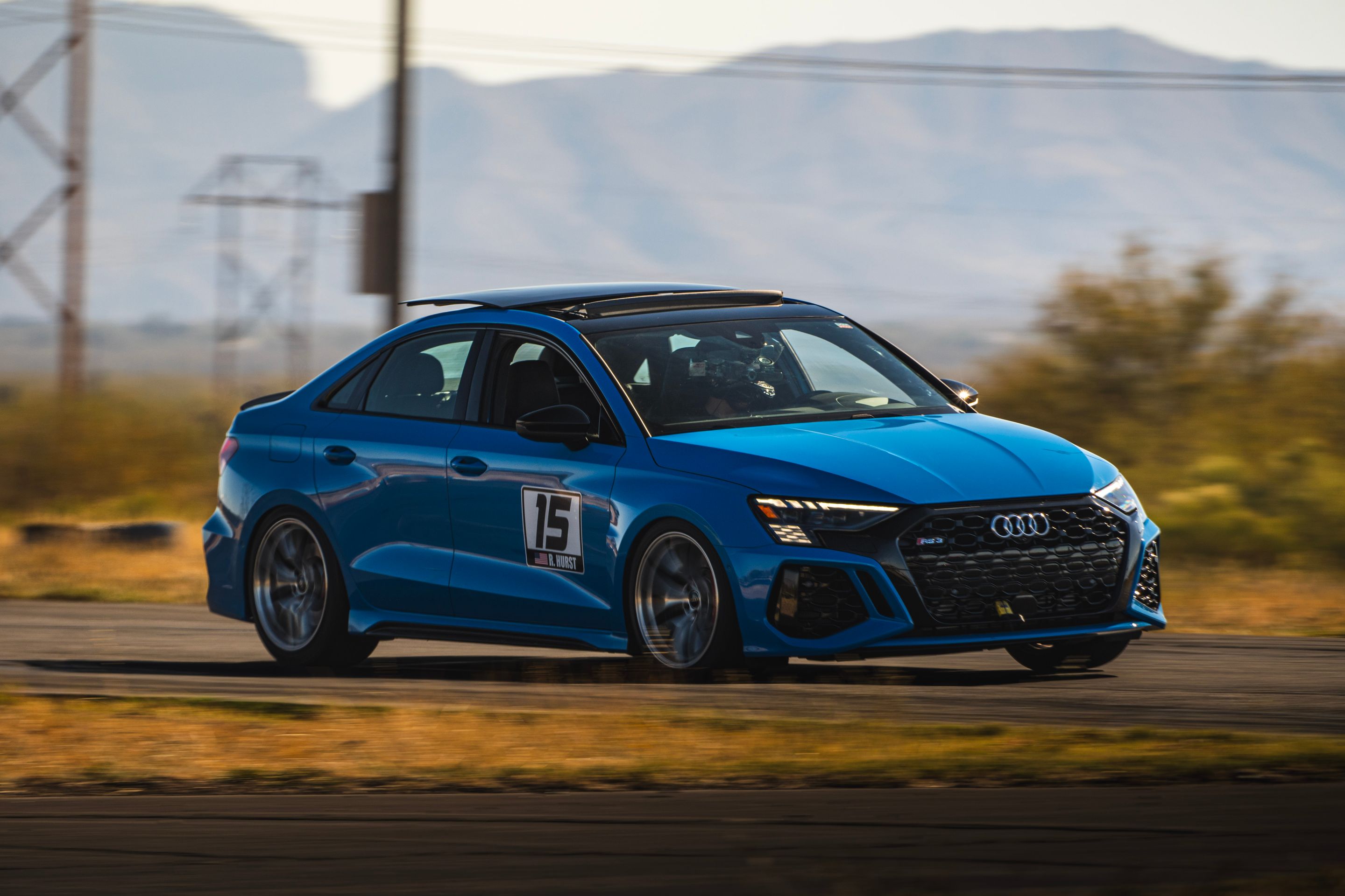 Blue Audi 8Y RS 3 with 18" VS-5RS Apex wheels in Brushed Clear