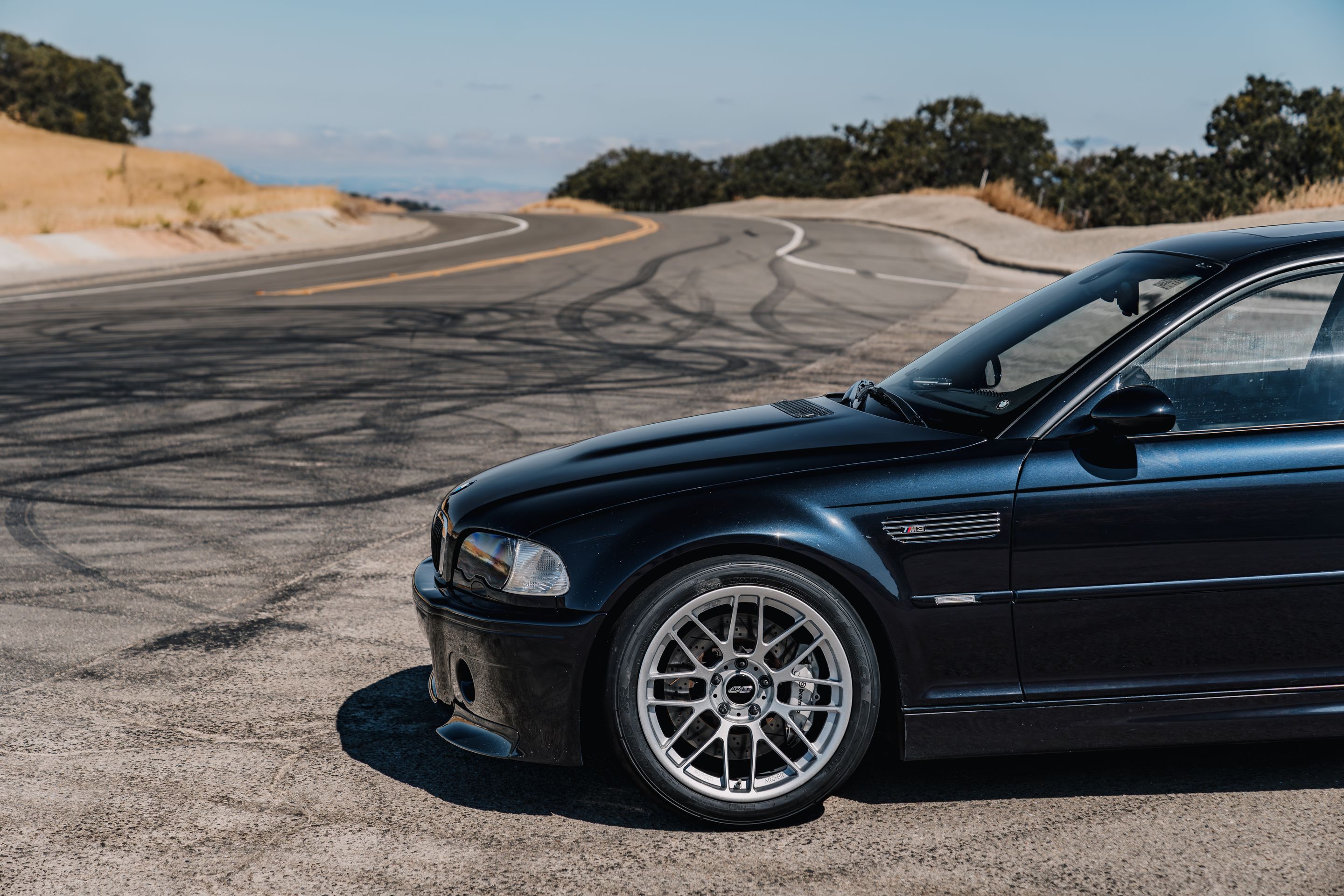 Black BMW E46 M3 with 18" ARC-8RT Apex wheels in Race Silver