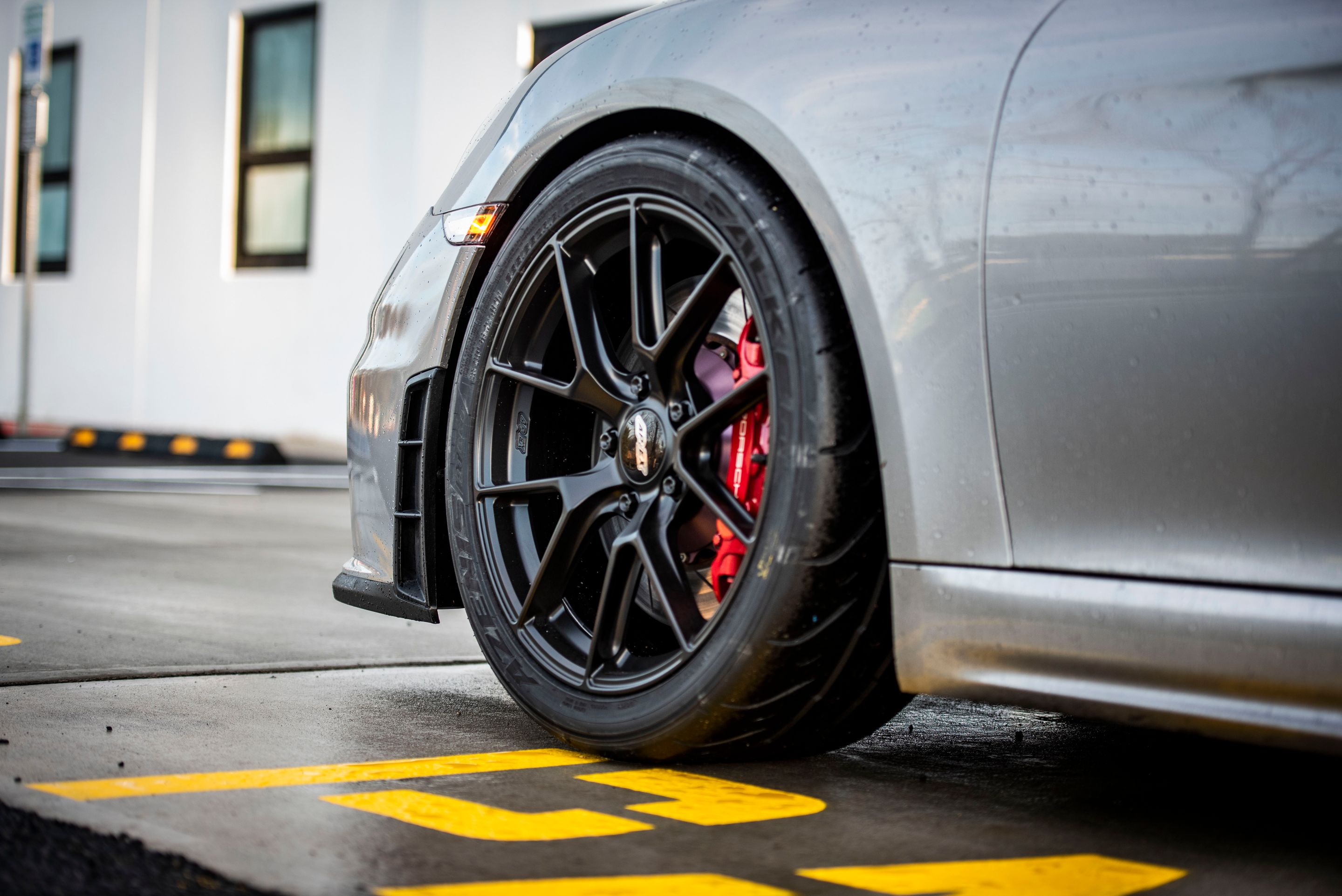 Silver Porsche 718 Cayman GT4 with 19" VS-5RS Apex wheels in Satin Black
