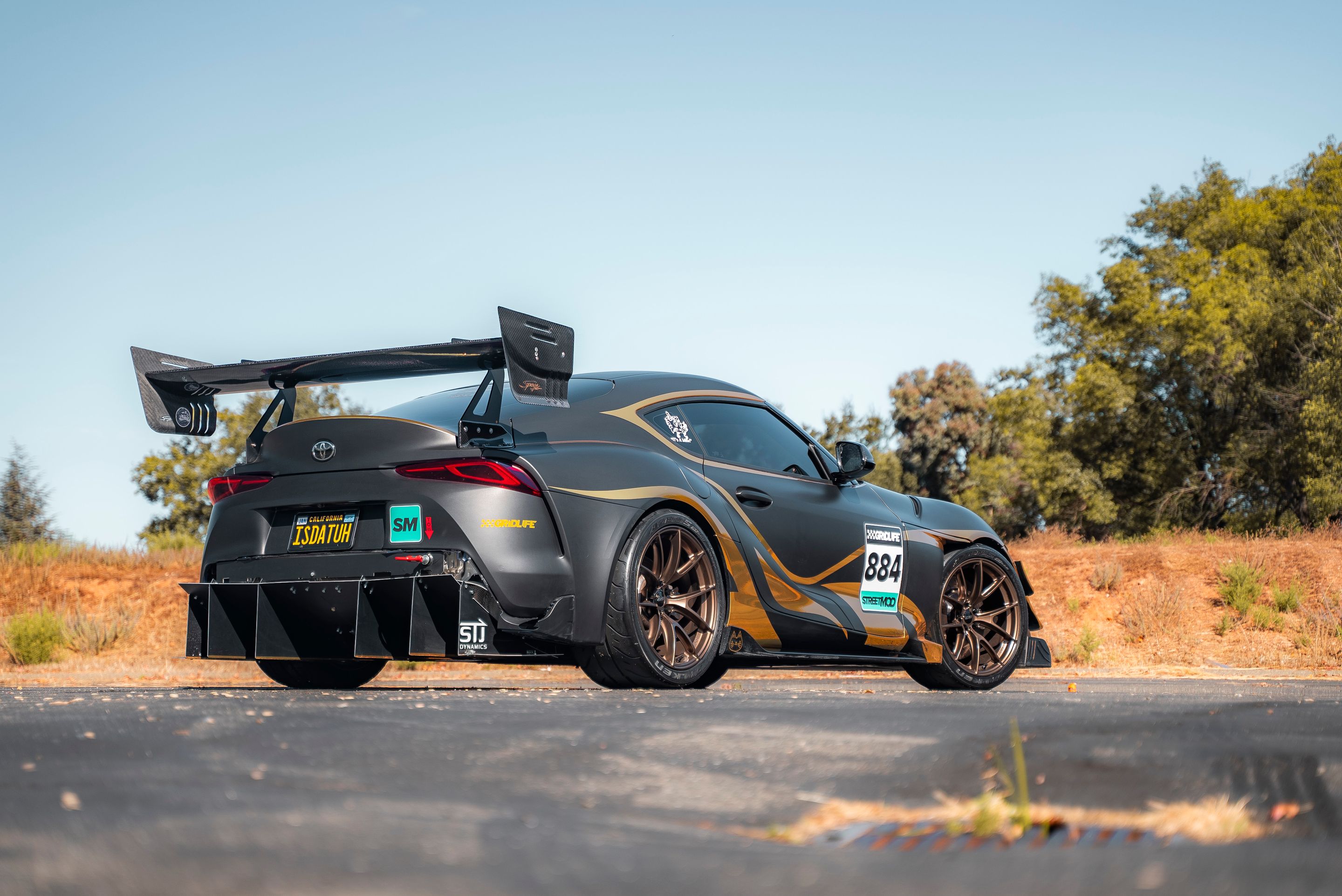 Grey Toyota GR Supra with 19" VS-5RS Apex wheels in Satin Bronze