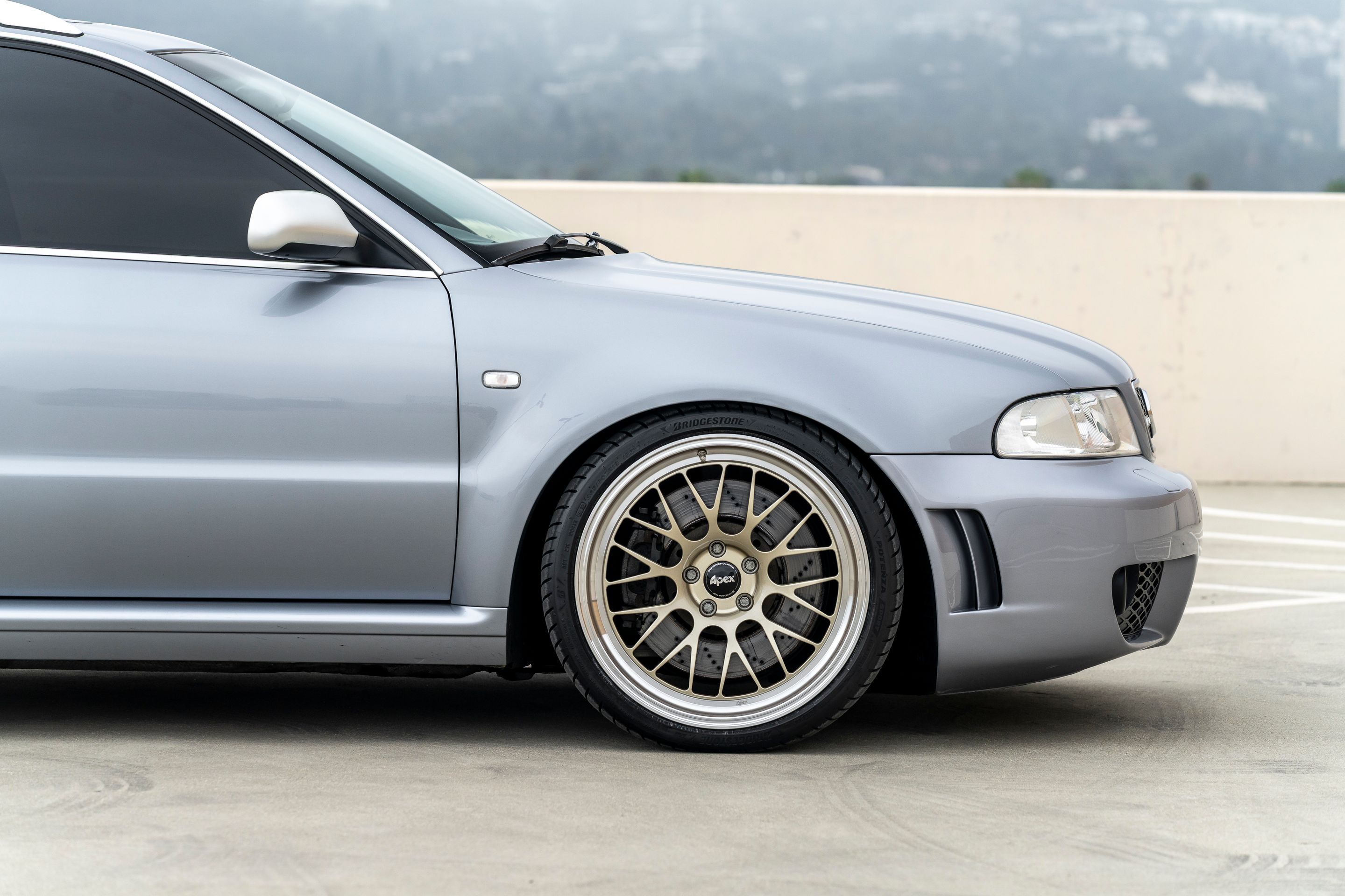 Silver Audi B5 RS 4 Avant/Wagon with 19" ML-10RT Apex wheels in Machined Lip Gloss Motorsport Gold