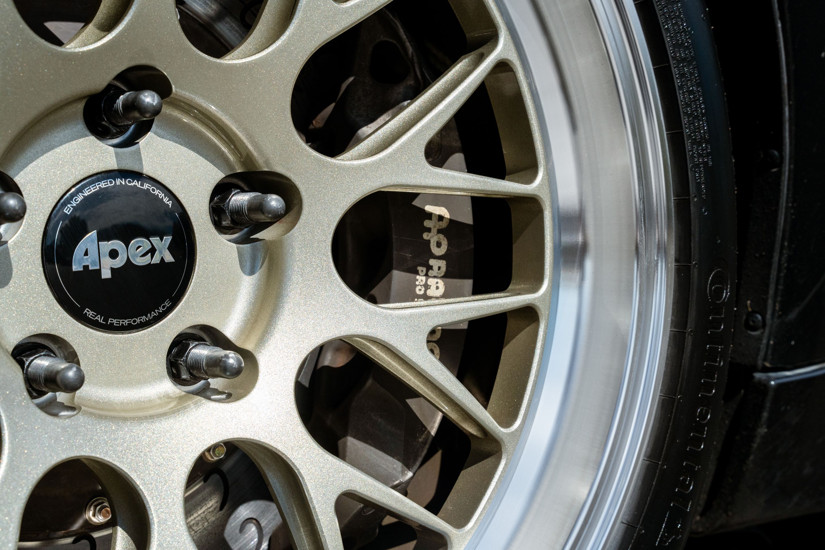 Black BMW F87 M2 with 18" ML-10RT Apex wheels in Machined Lip Gloss Motorsport Gold