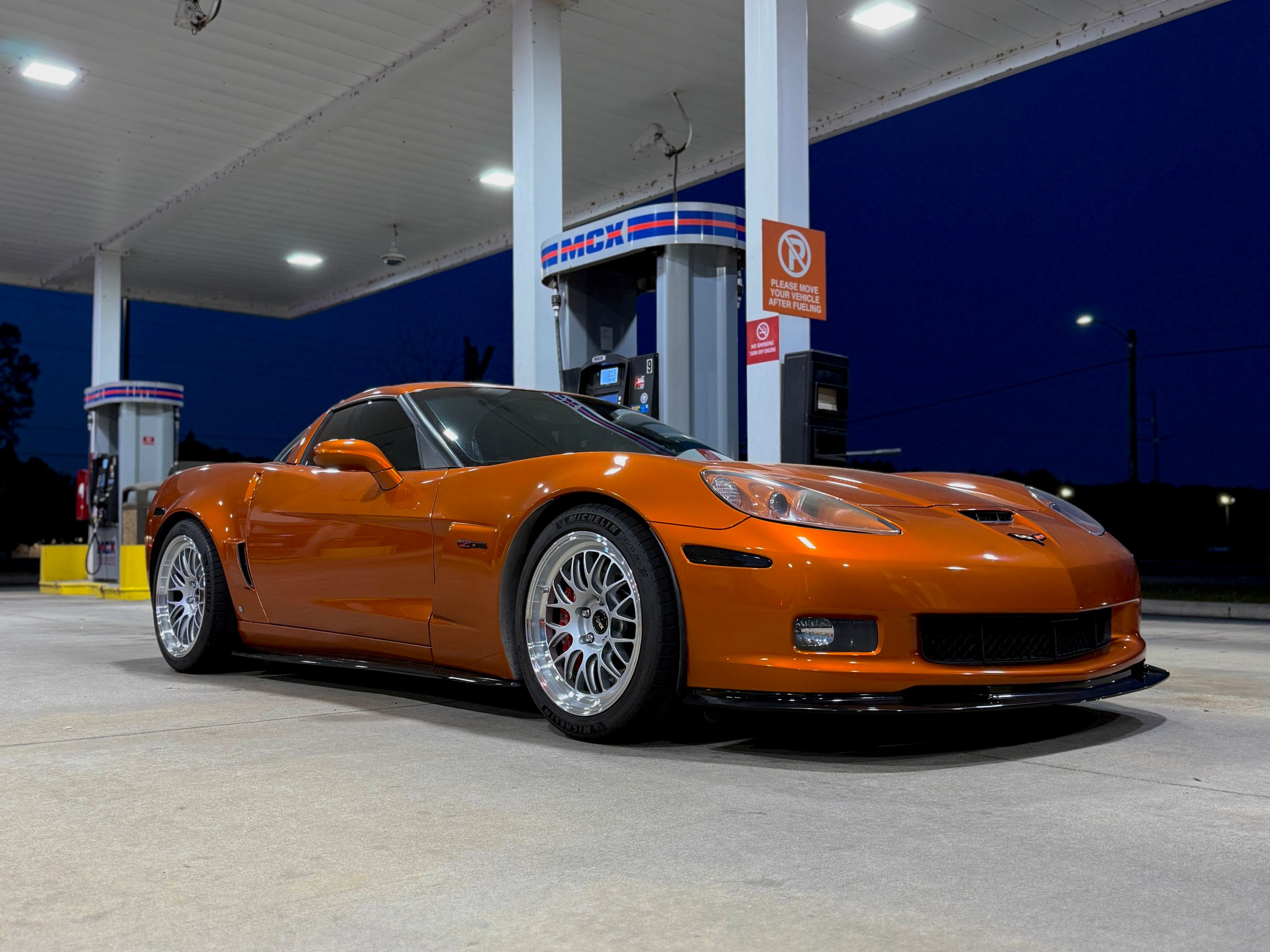Orange Chevrolet C6 Corvette Z06 with 18"/19" ML-10RT Apex wheels in Machined Lip Race Silver