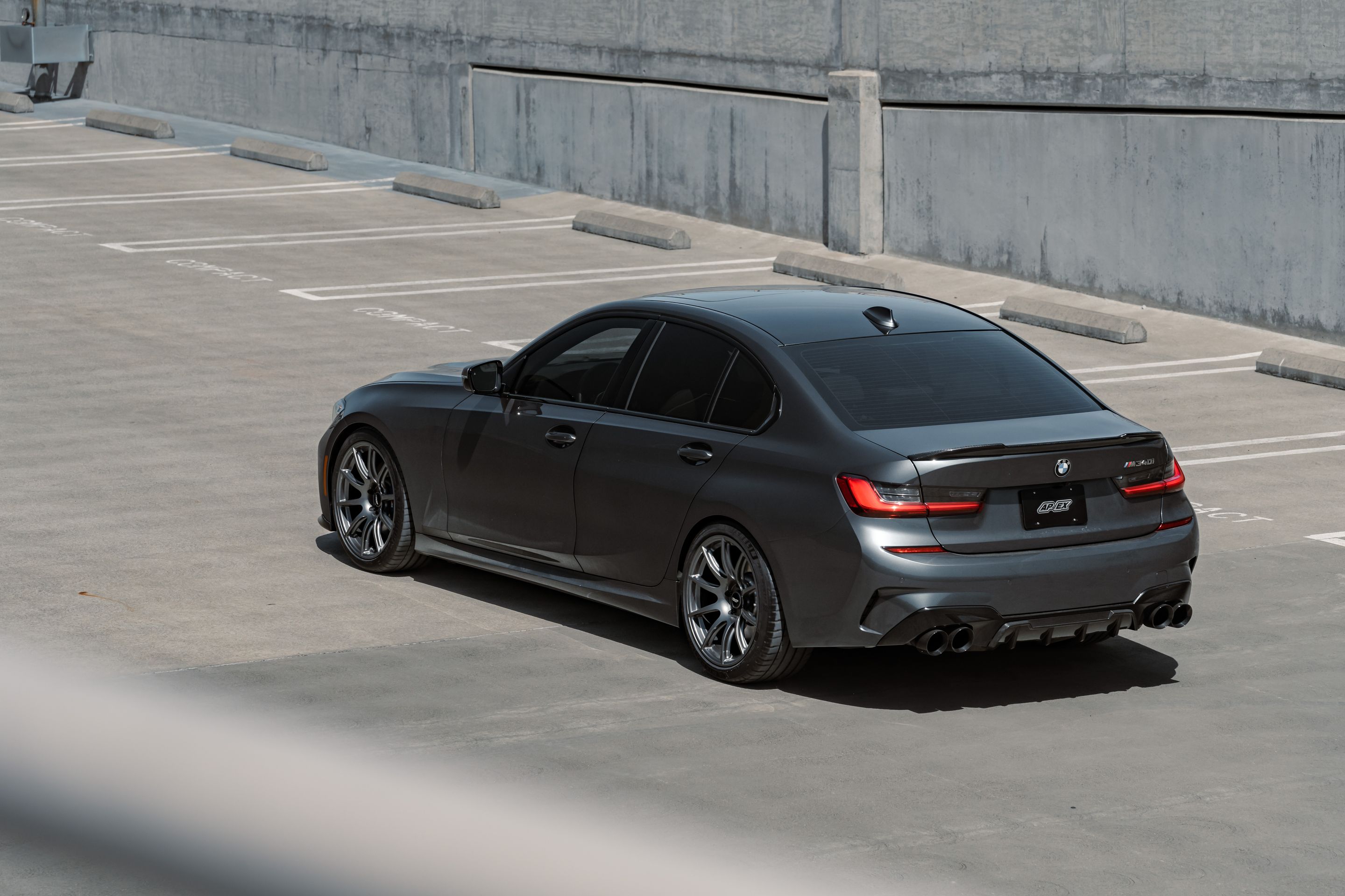 Grey BMW G20 Sedan 3 Series with 19" SM-10 Apex wheels in Anthracite
