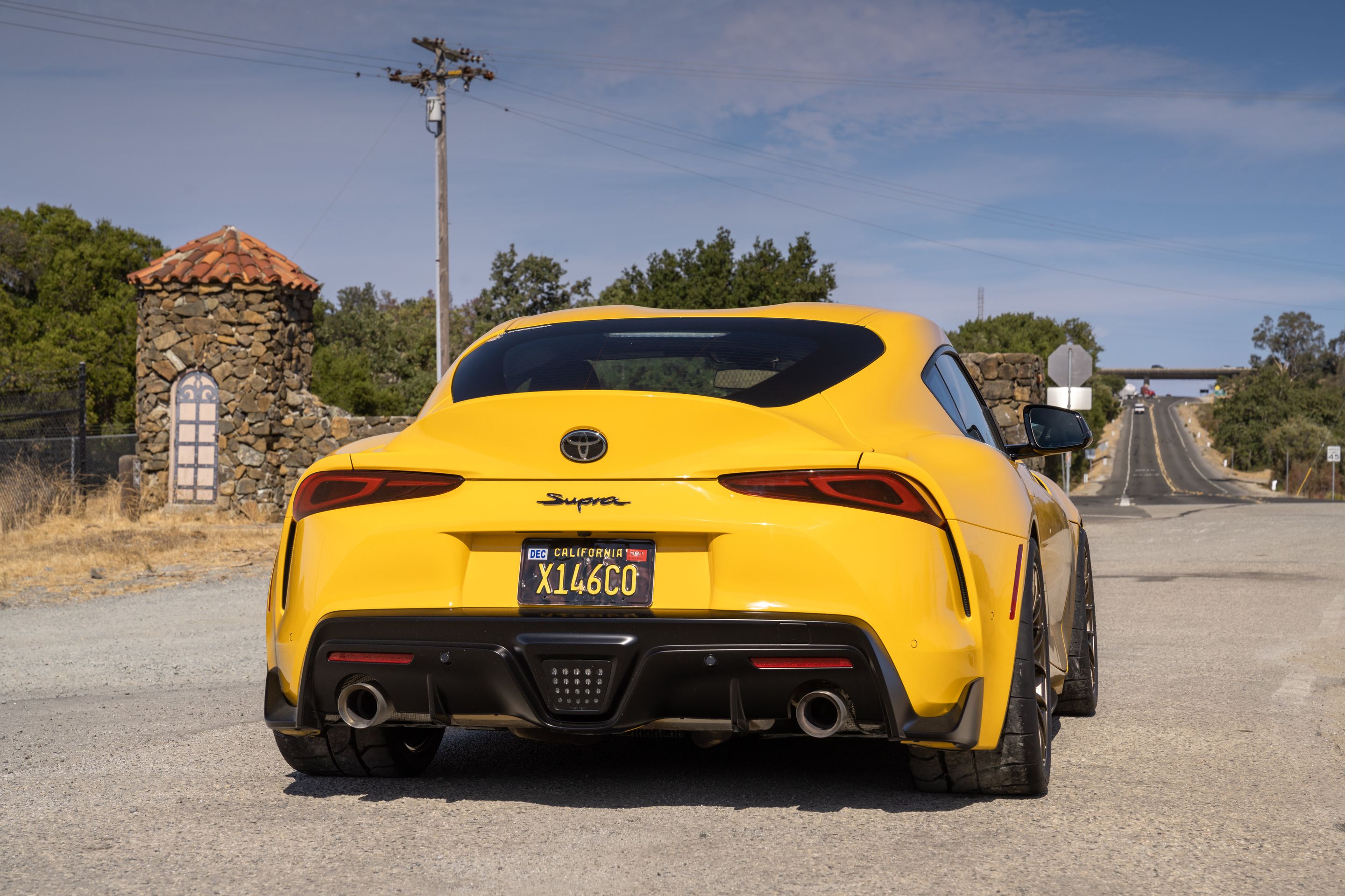 Yellow Toyota GR Supra with 18" EC-7RS Apex wheels in Satin Bronze