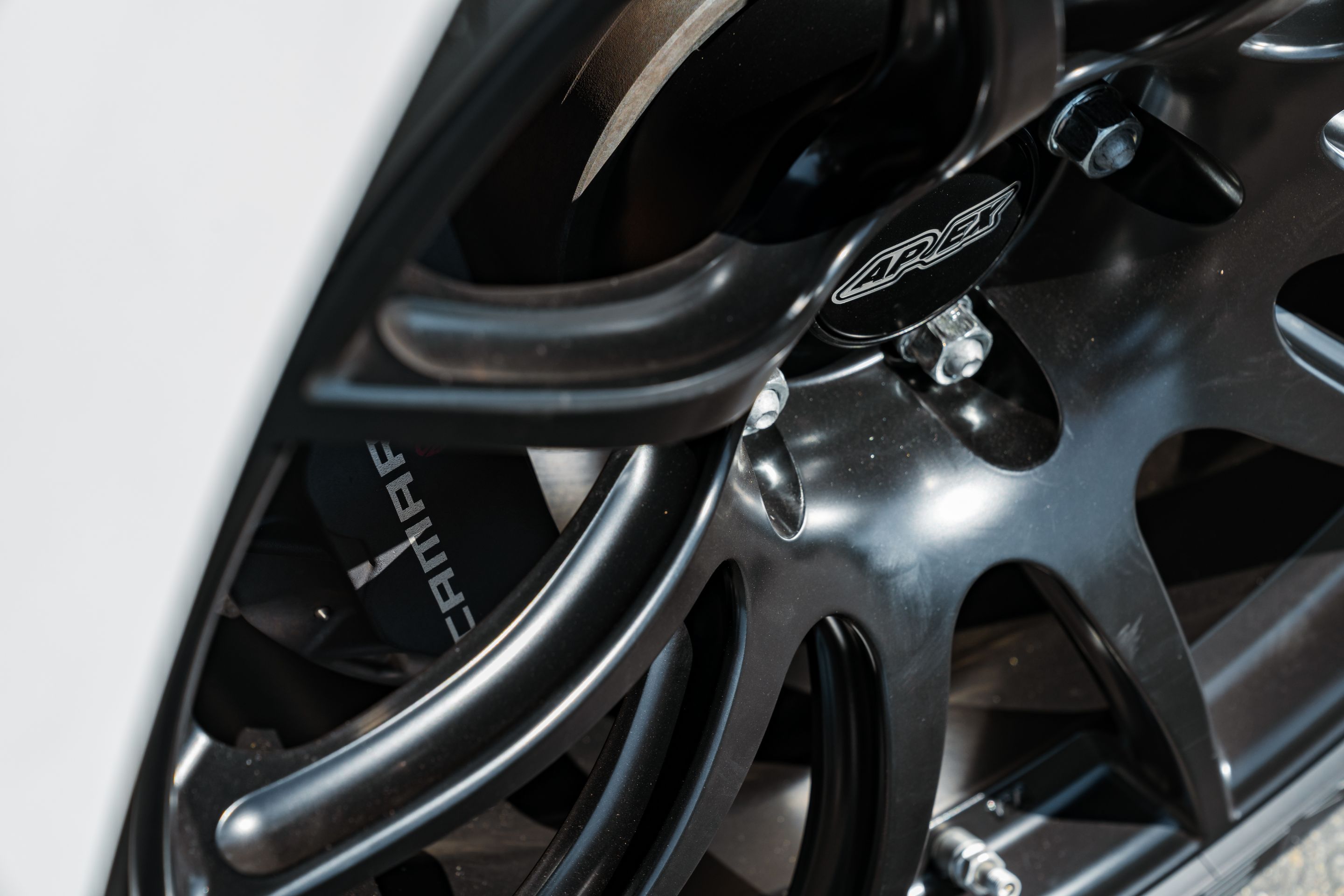 White Chevrolet 6th Gen Camaro SS with 19" SM-10 Apex wheels in Satin Black