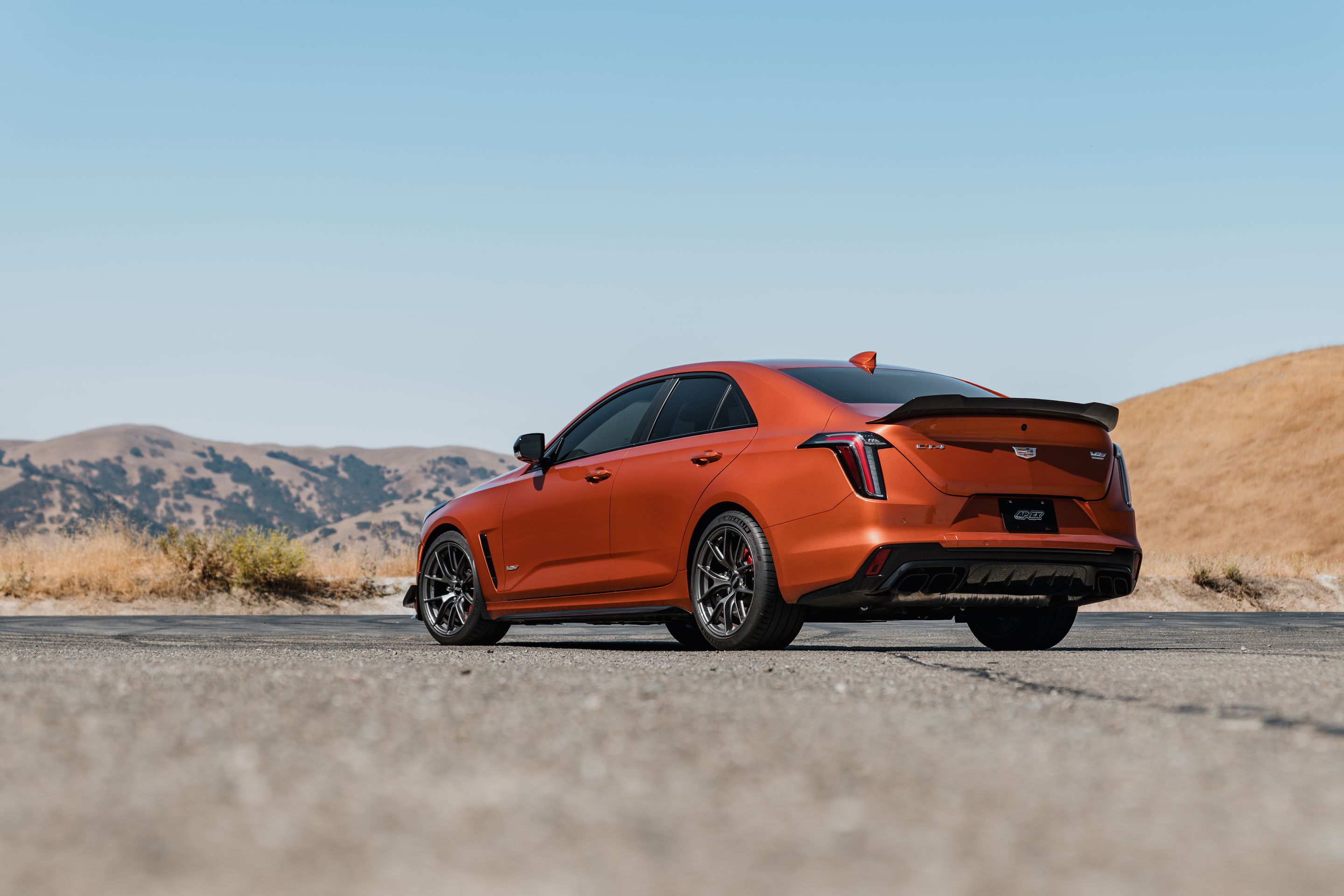 Orange Cadillac CT4-V Blackwing with 18" VS-5RS Apex wheels in Anthracite