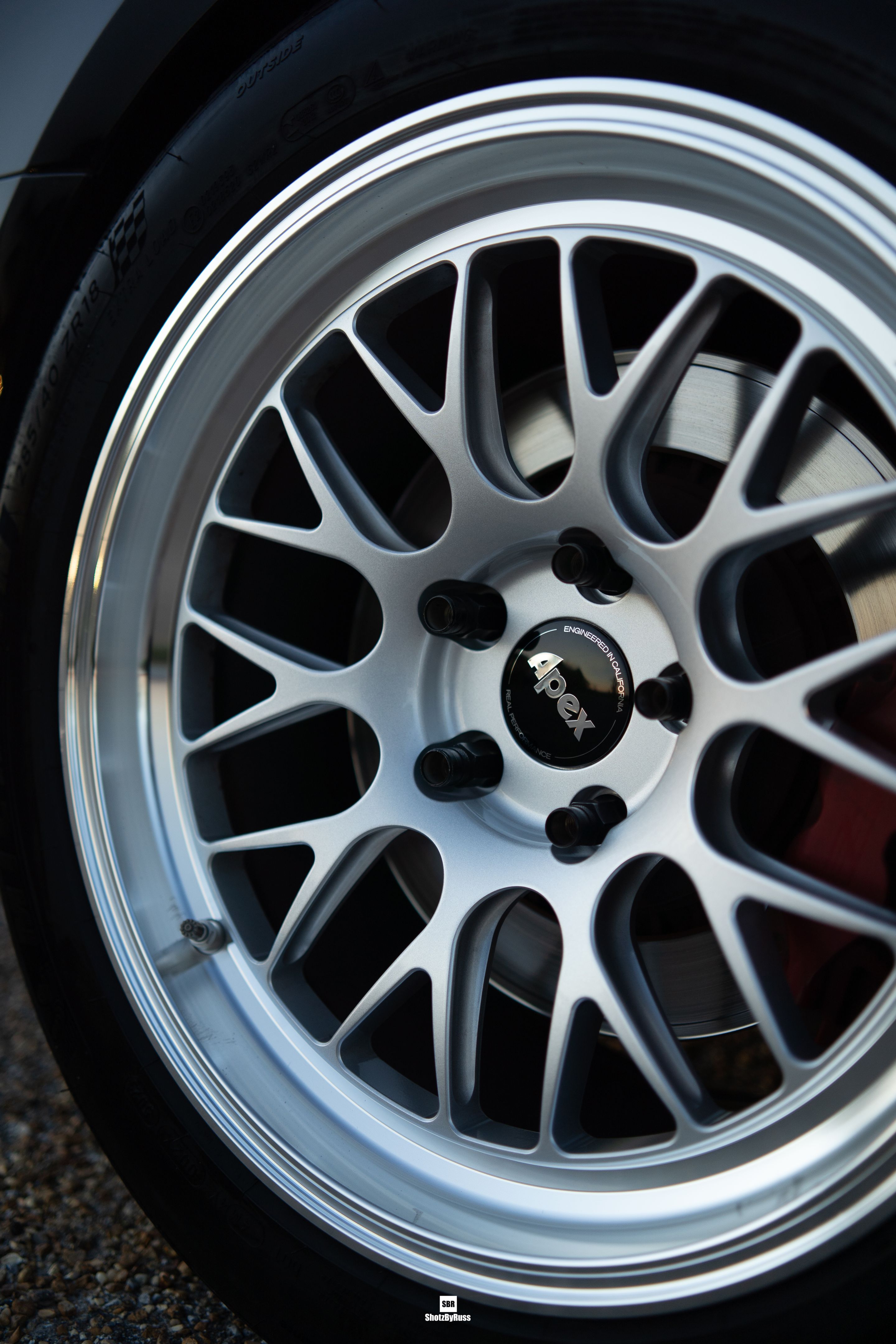 Black Cadillac ATS-V with 18" ML-10RT Apex wheels in Machined Lip Race Silver