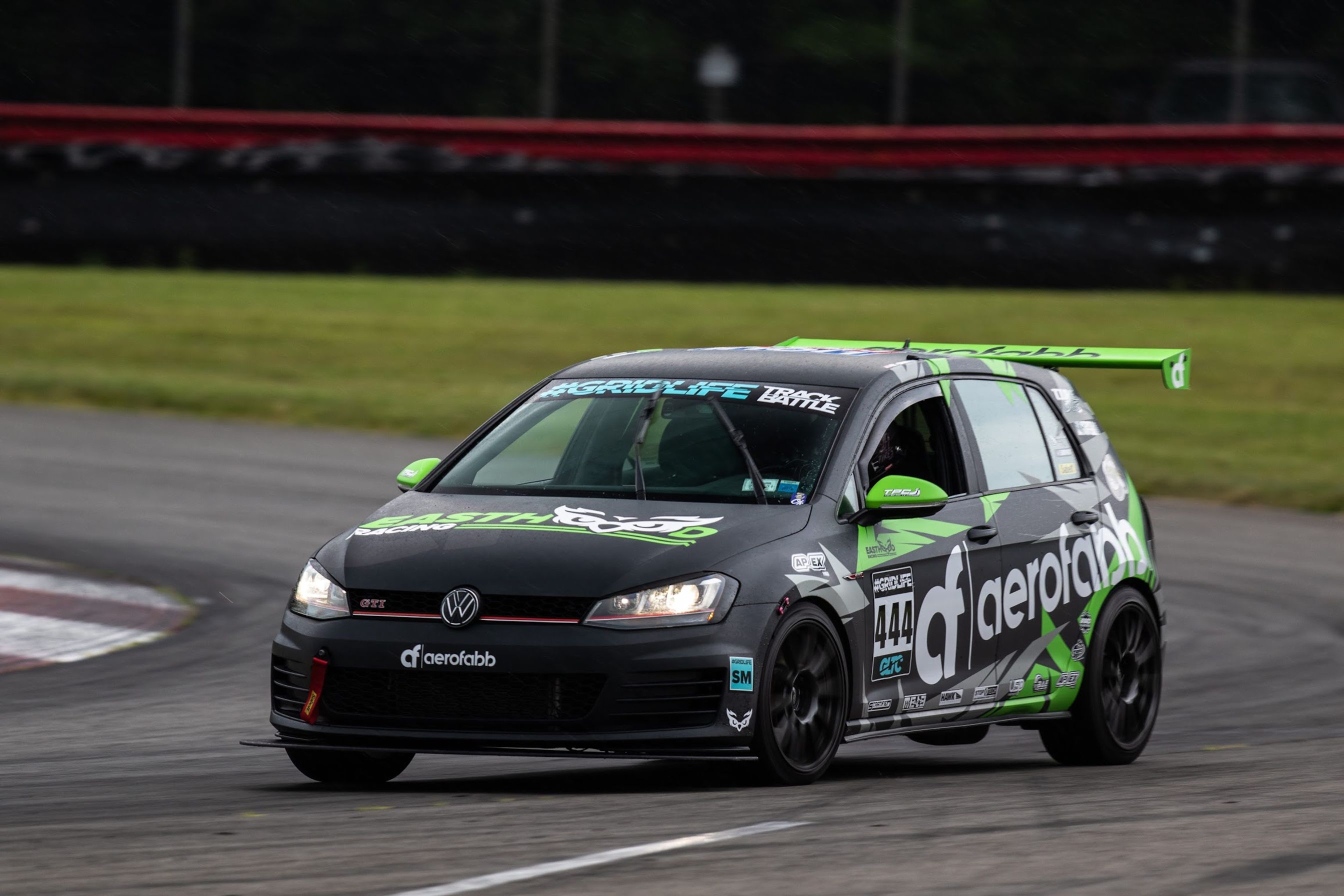 Race Livery VW MK7 GTI with 18" SM-10 Apex wheels in Satin Black