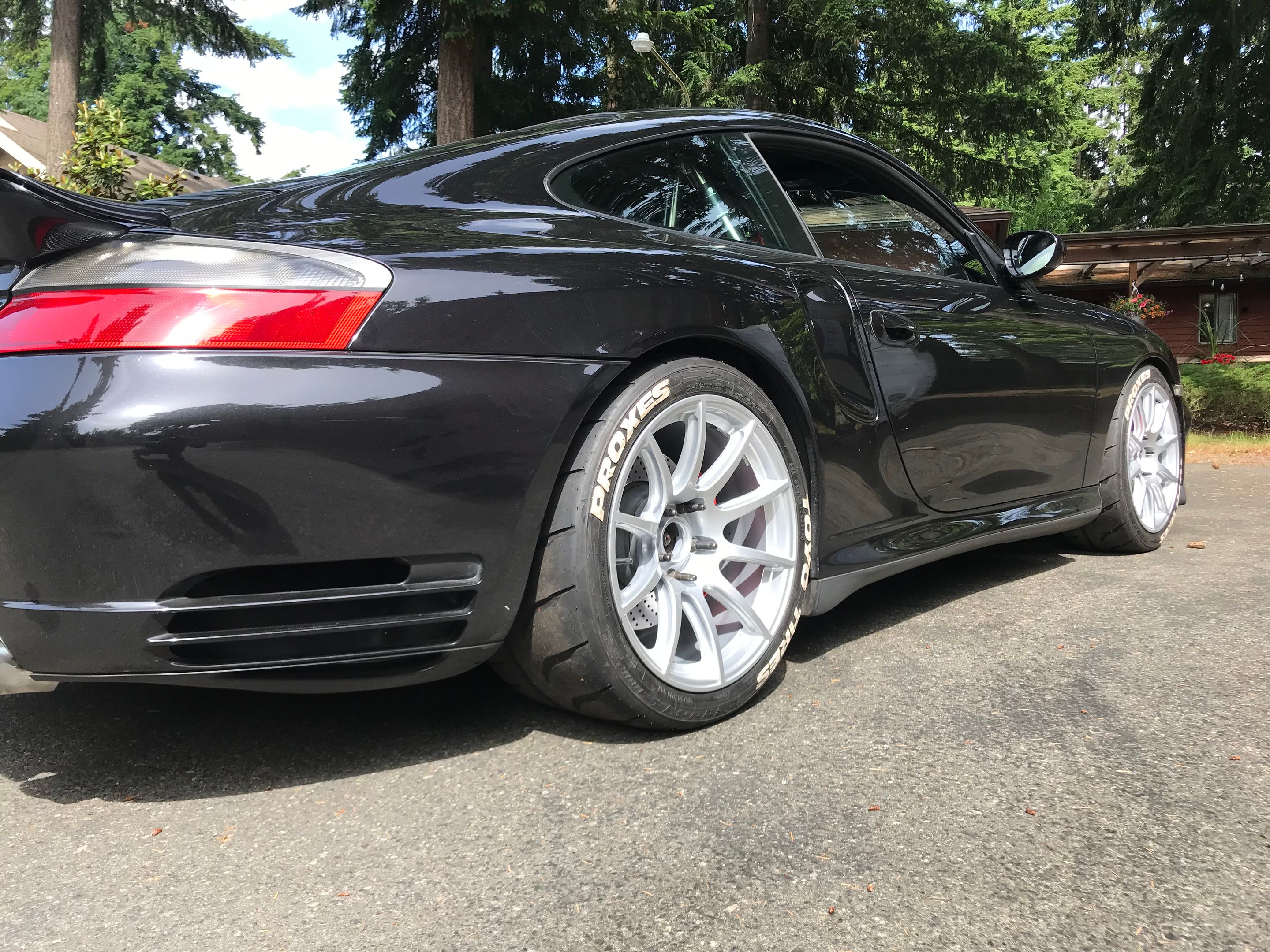 Black Porsche 911 996 Turbo with 18" SM-10 Apex wheels in Race Silver