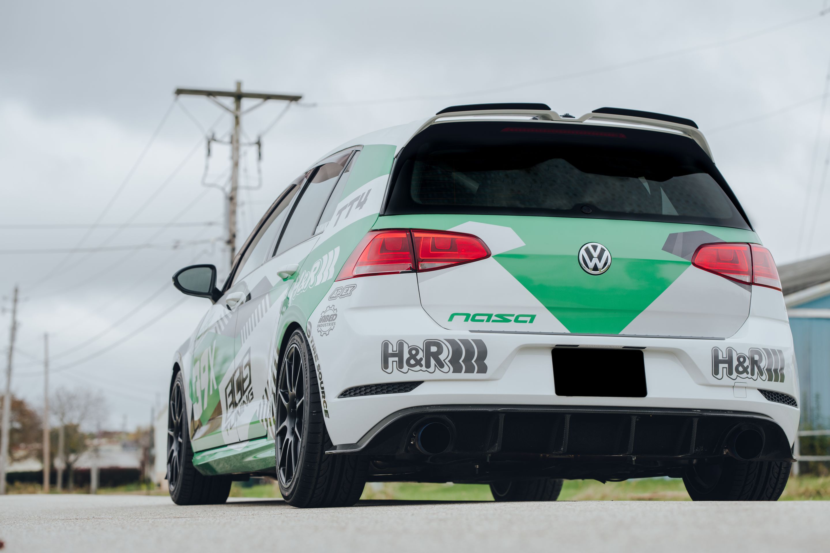 Race Livery VW MK7 GTI with 18" SM-10 Apex wheels in Satin Black