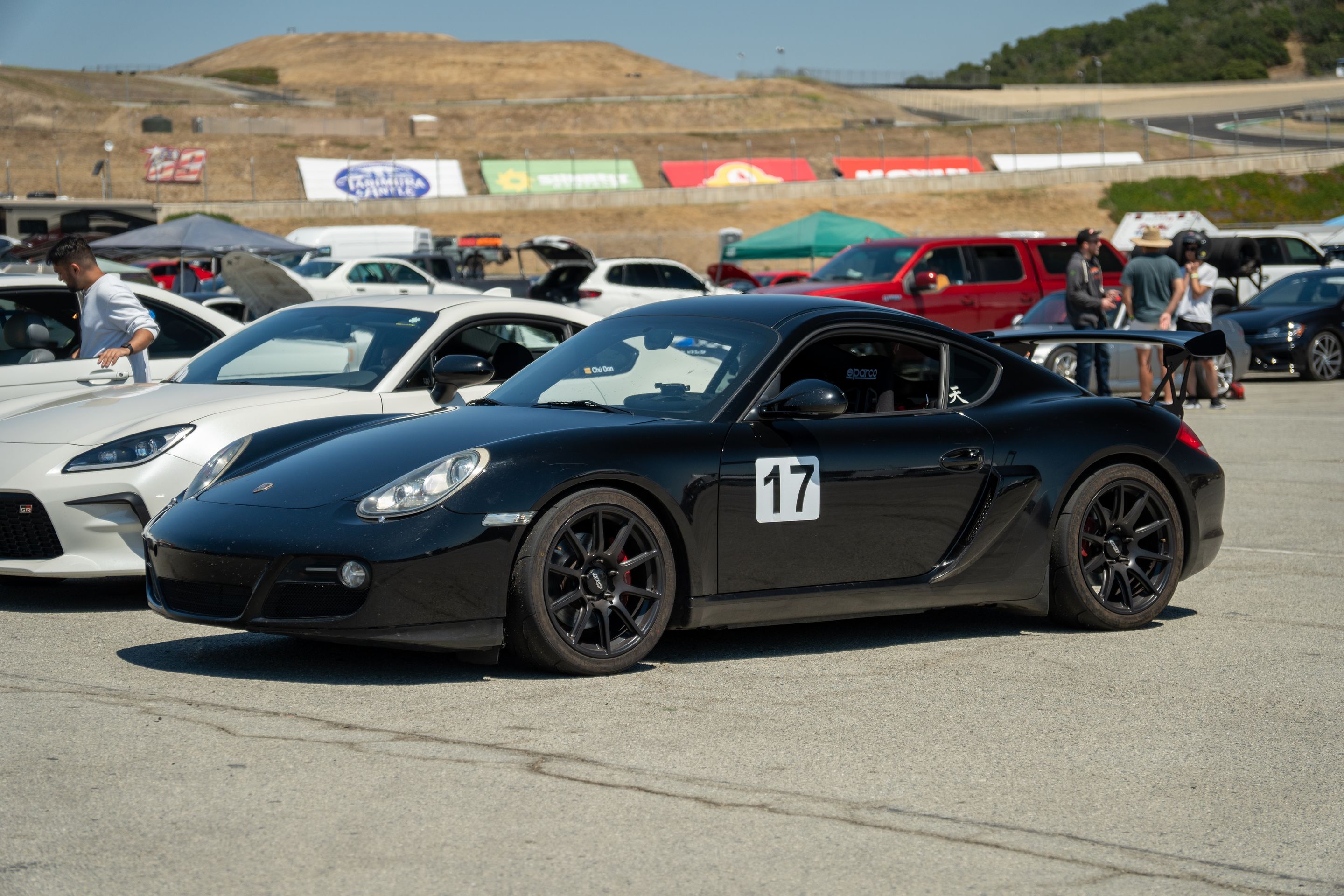 Black Porsche 987 Cayman S with 18" SM-10 Apex wheels in Satin Black