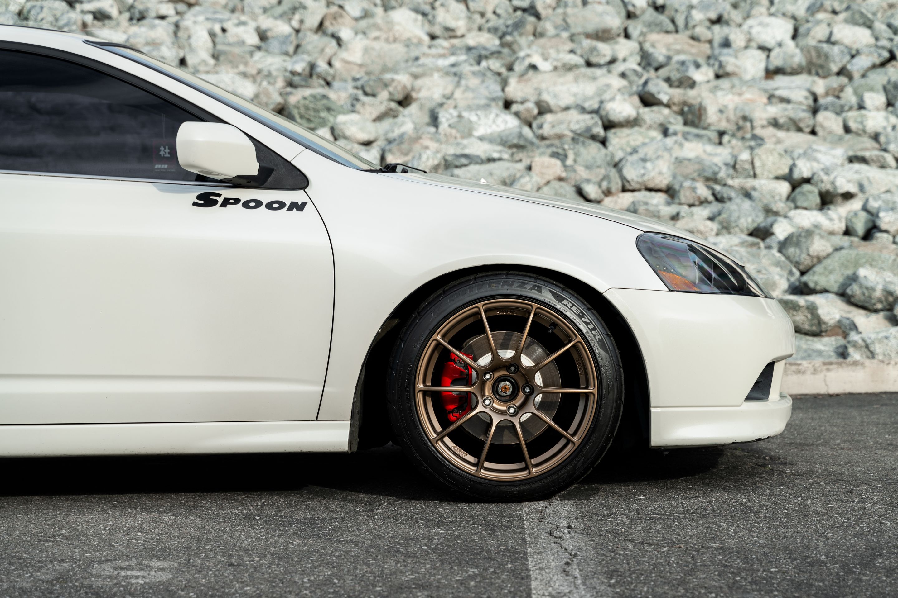 White Acura DC5 RSX with 17" SM-10RS Apex wheels in Satin Bronze