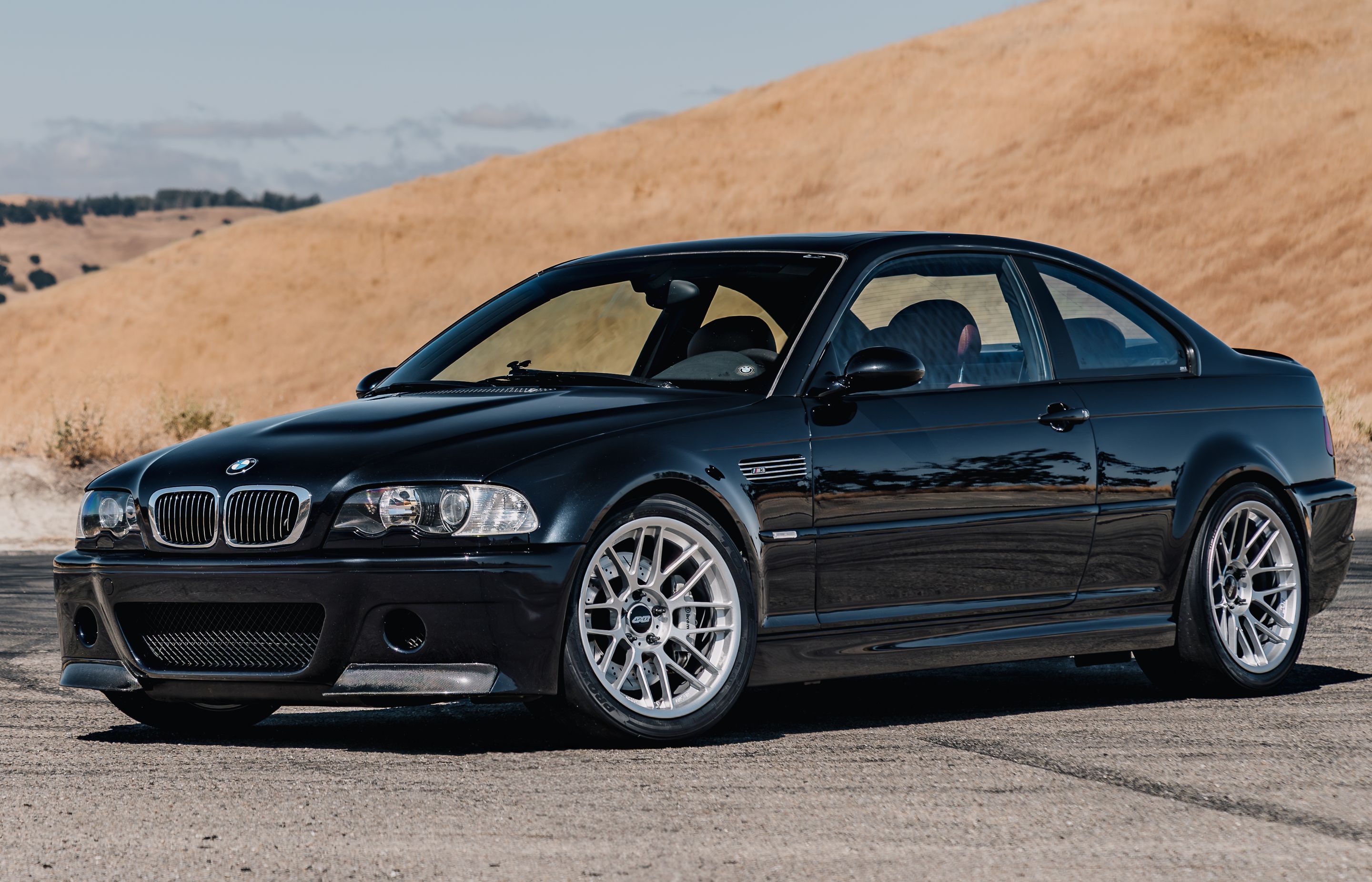 Black BMW E46 M3 with 18" ARC-8RT Apex wheels in Race Silver