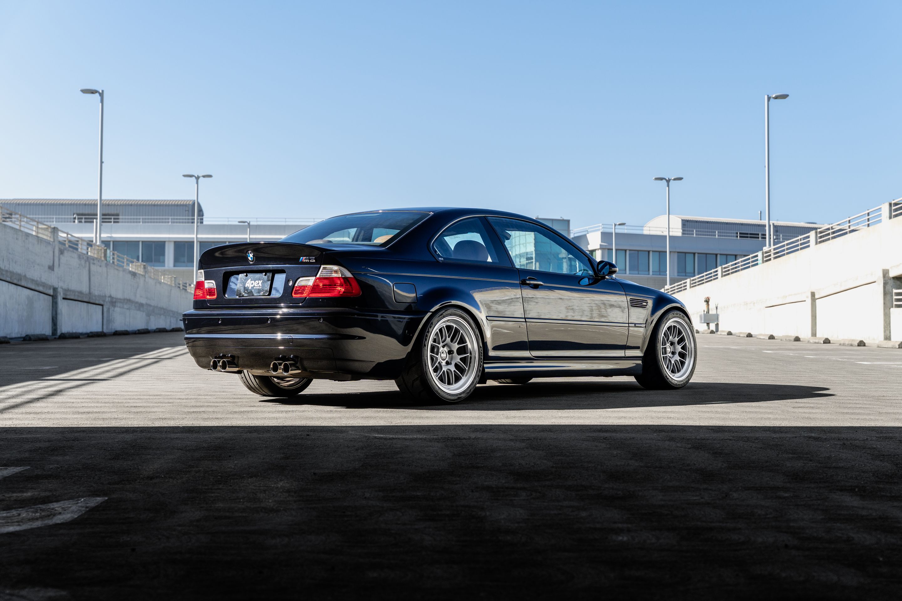 Black BMW E46 M3 with 18" ML-7RT Apex wheels in Machined Lip Race Silver
