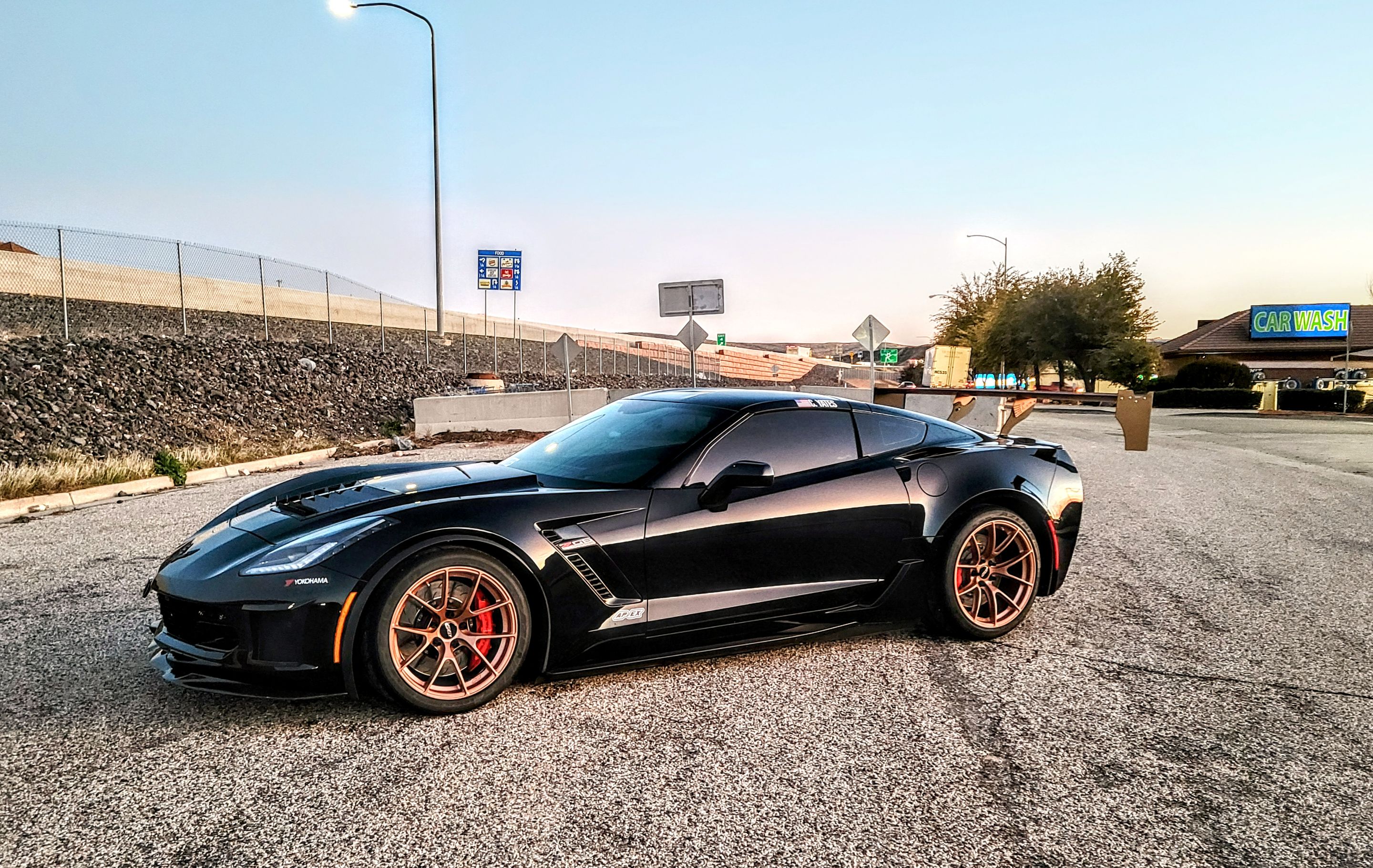 Black Chevrolet C7 Corvette Z06 with 18"/19" VS-5RS Apex wheels in Custom Finish