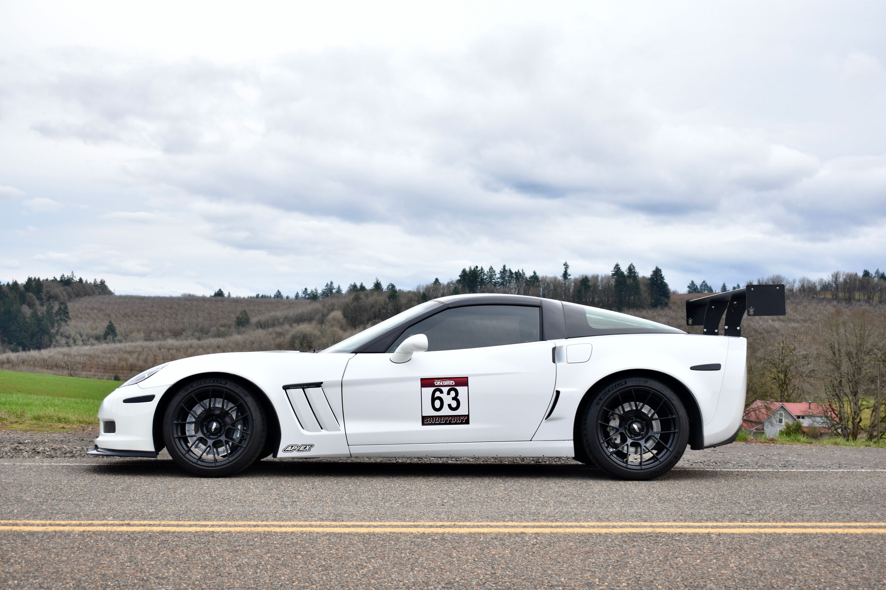 White Chevrolet C6 Corvette Grand Sport with 18"/19" EC-7RS Apex wheels in Satin Black