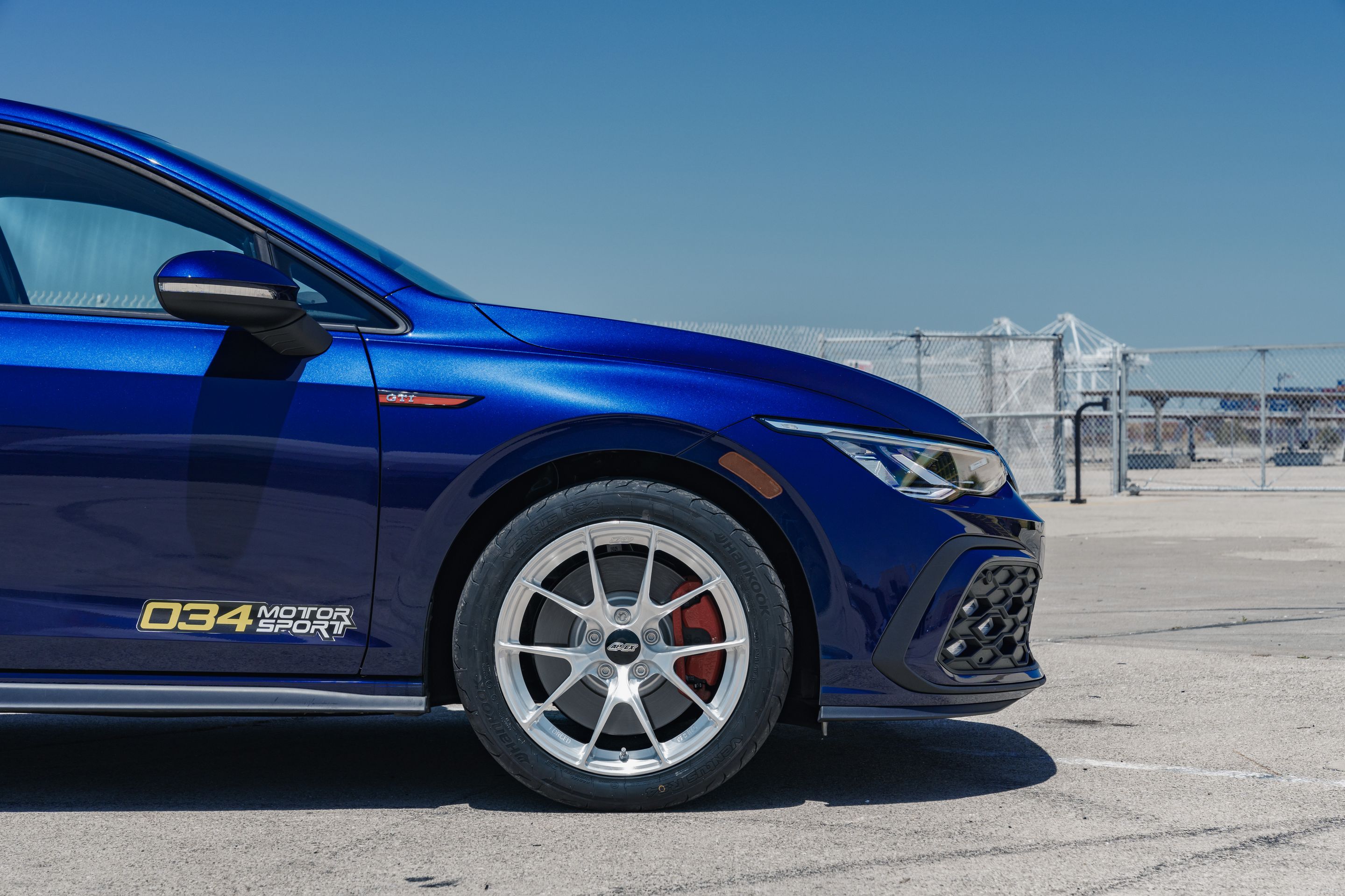 Blue VW MK8 GTI with 17" VS-5RS Apex wheels in Brushed Clear