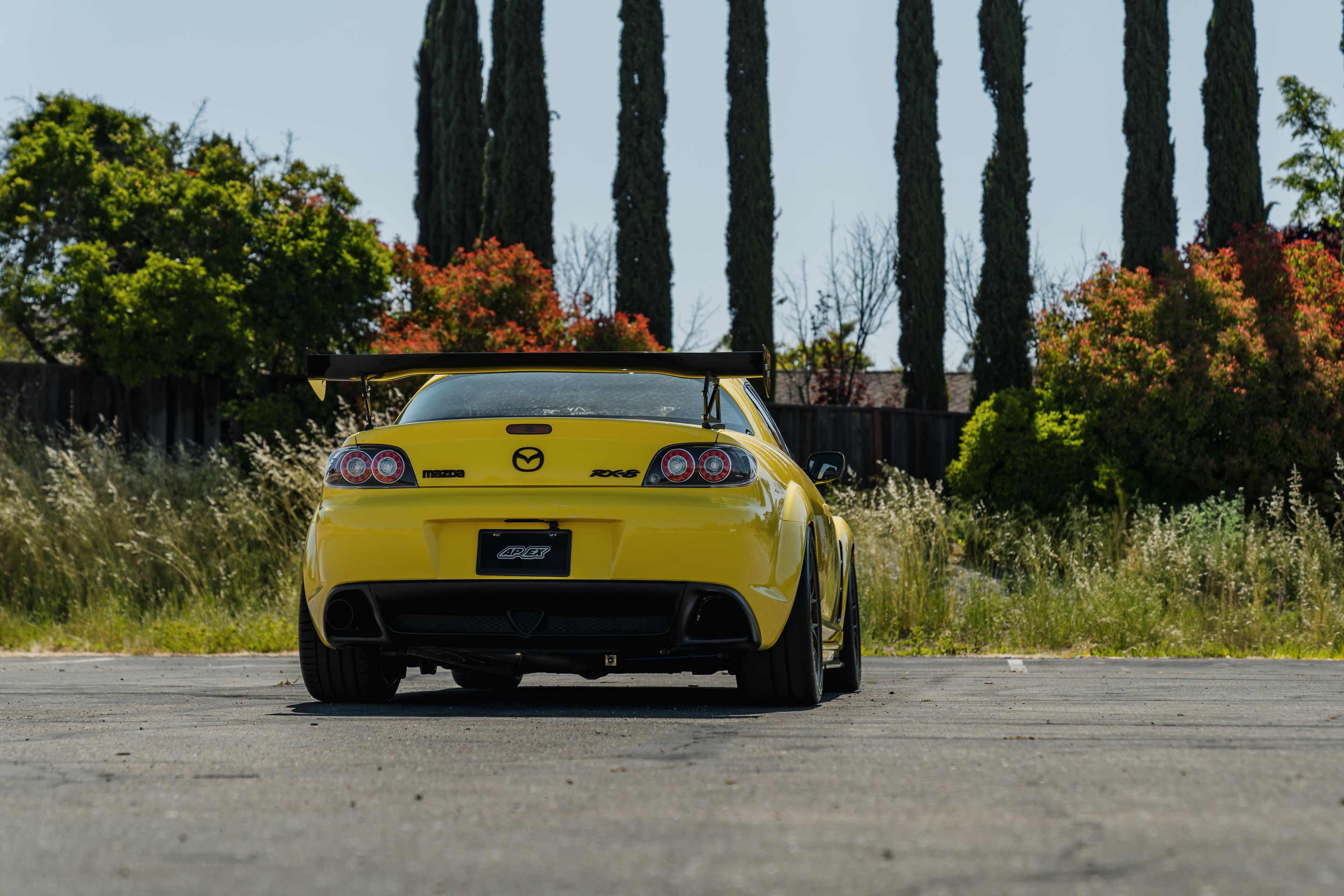 Yellow Mazda RX-8 with 18" EC-7 Apex wheels in Satin Bronze