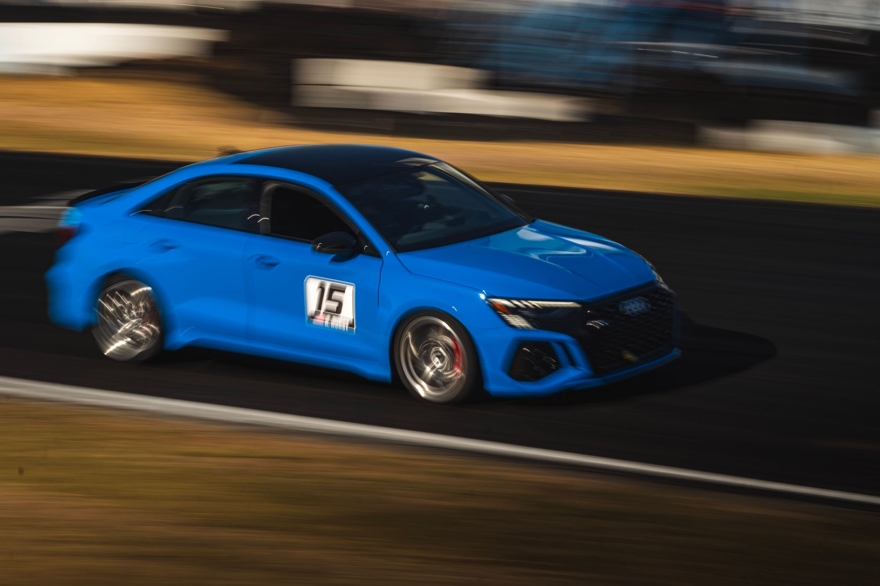 Blue Audi 8Y RS 3 with 18" VS-5RS Apex wheels in Brushed Clear