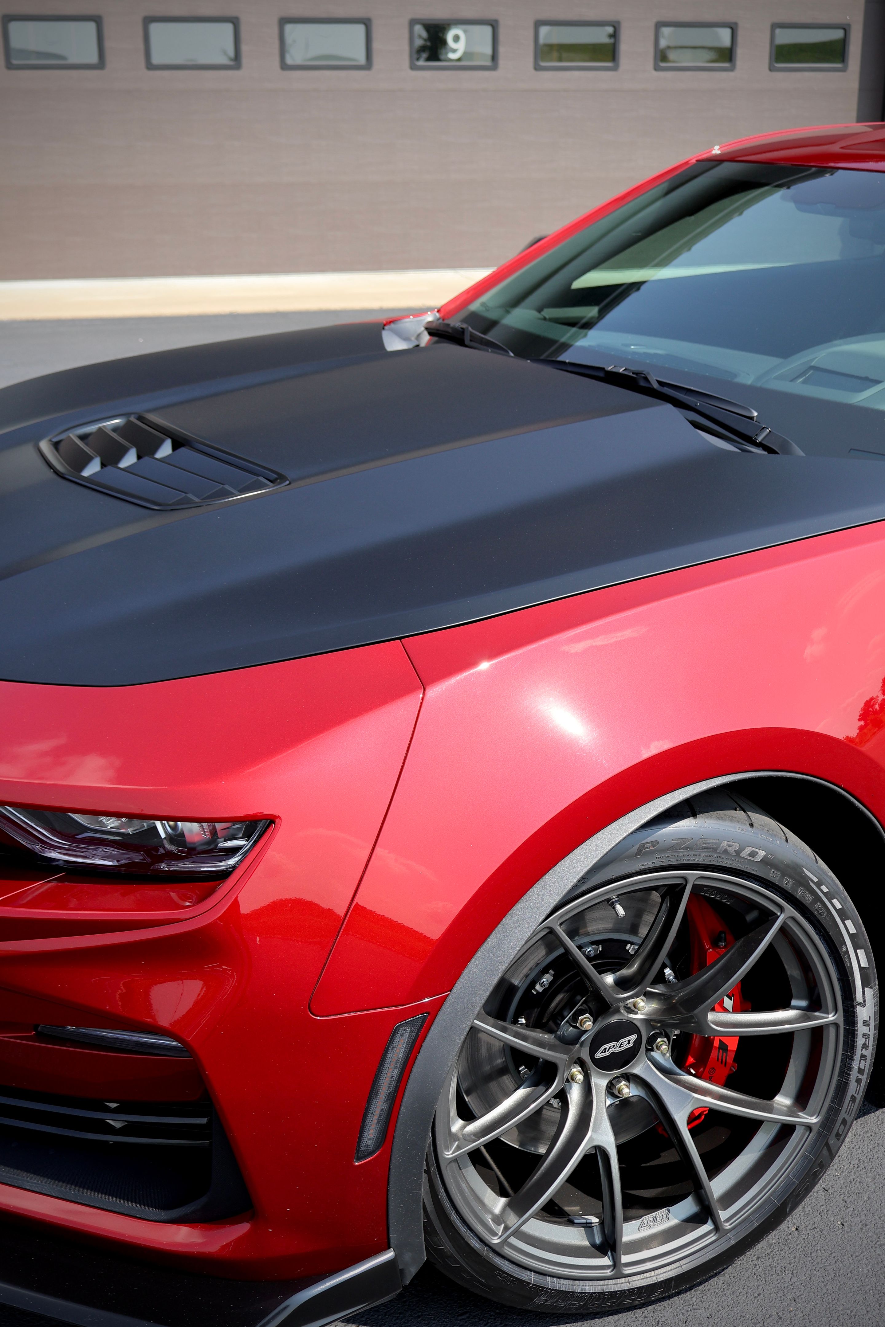 Red Chevrolet 6th Gen Camaro SS 1LE with 19" VS-5RS Apex wheels in Anthracite