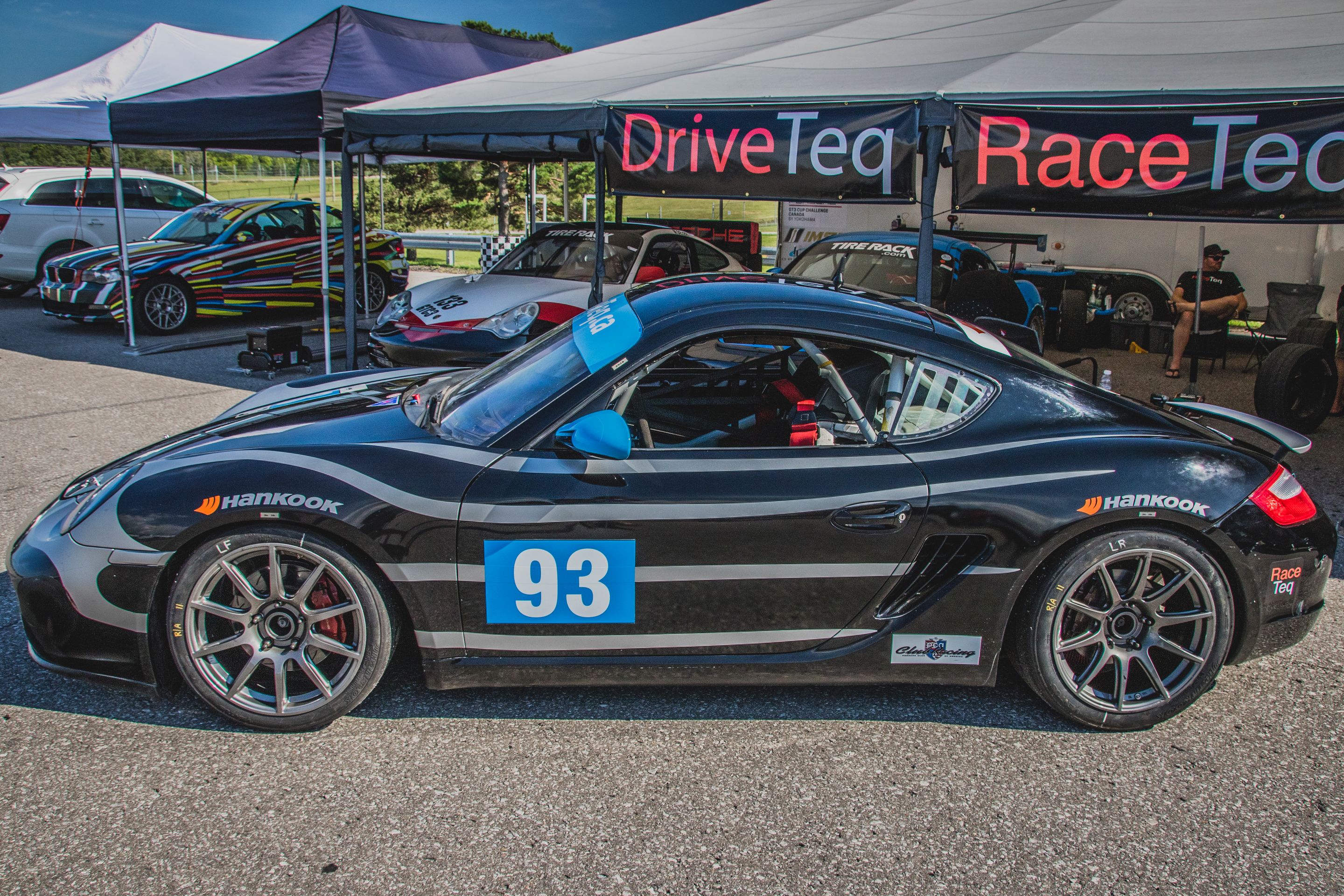 Black Porsche 987 Spec Cayman (SPC) with 18" SM-10 Apex wheels in Anthracite