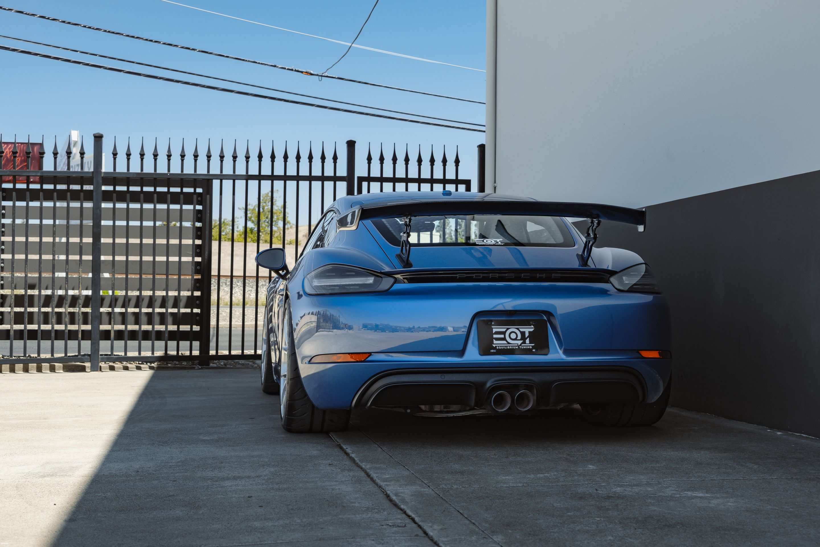 Blue Porsche 718 Cayman GTS 2.5L with 19" VS-5RS Apex wheels in Brushed Clear