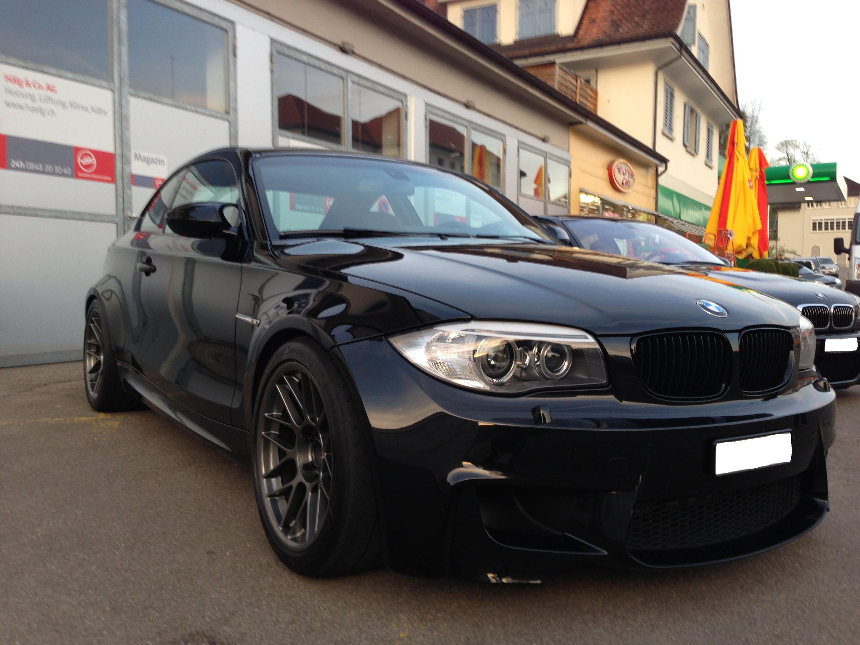 Black BMW E82 1M with 18" ARC-8 Apex wheels in Anthracite