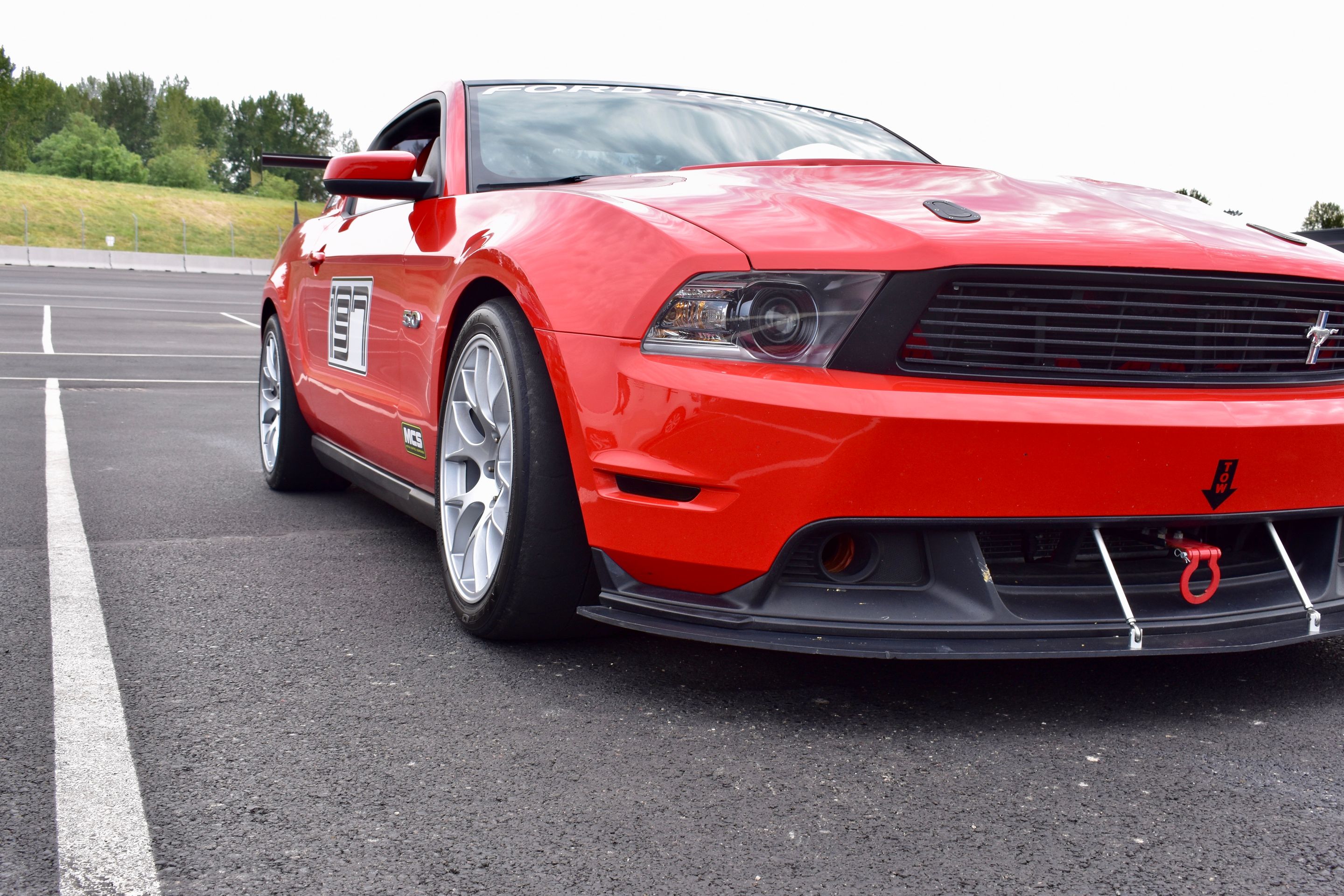 Red Ford S197 Mustang GT with 18" EC-7 Apex wheels in Race Silver