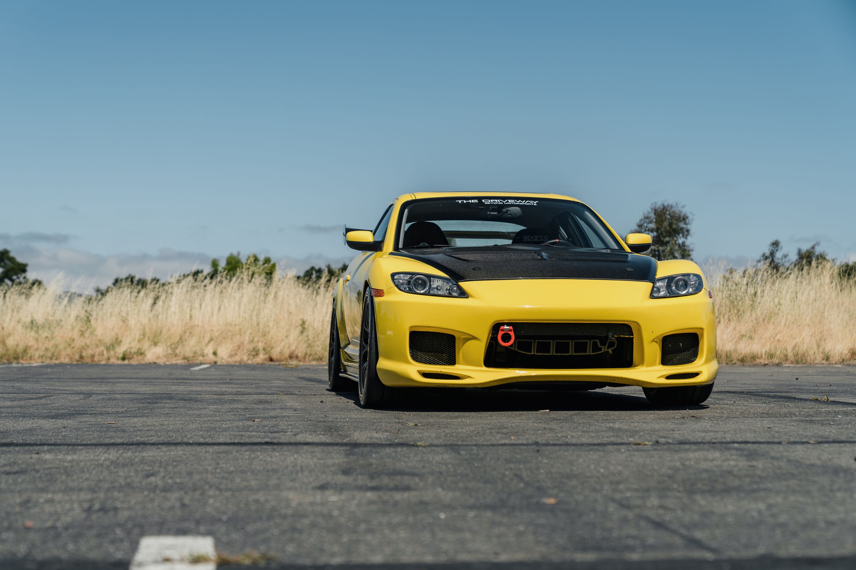 Yellow Mazda RX-8 with 18" EC-7 Apex wheels in Satin Bronze