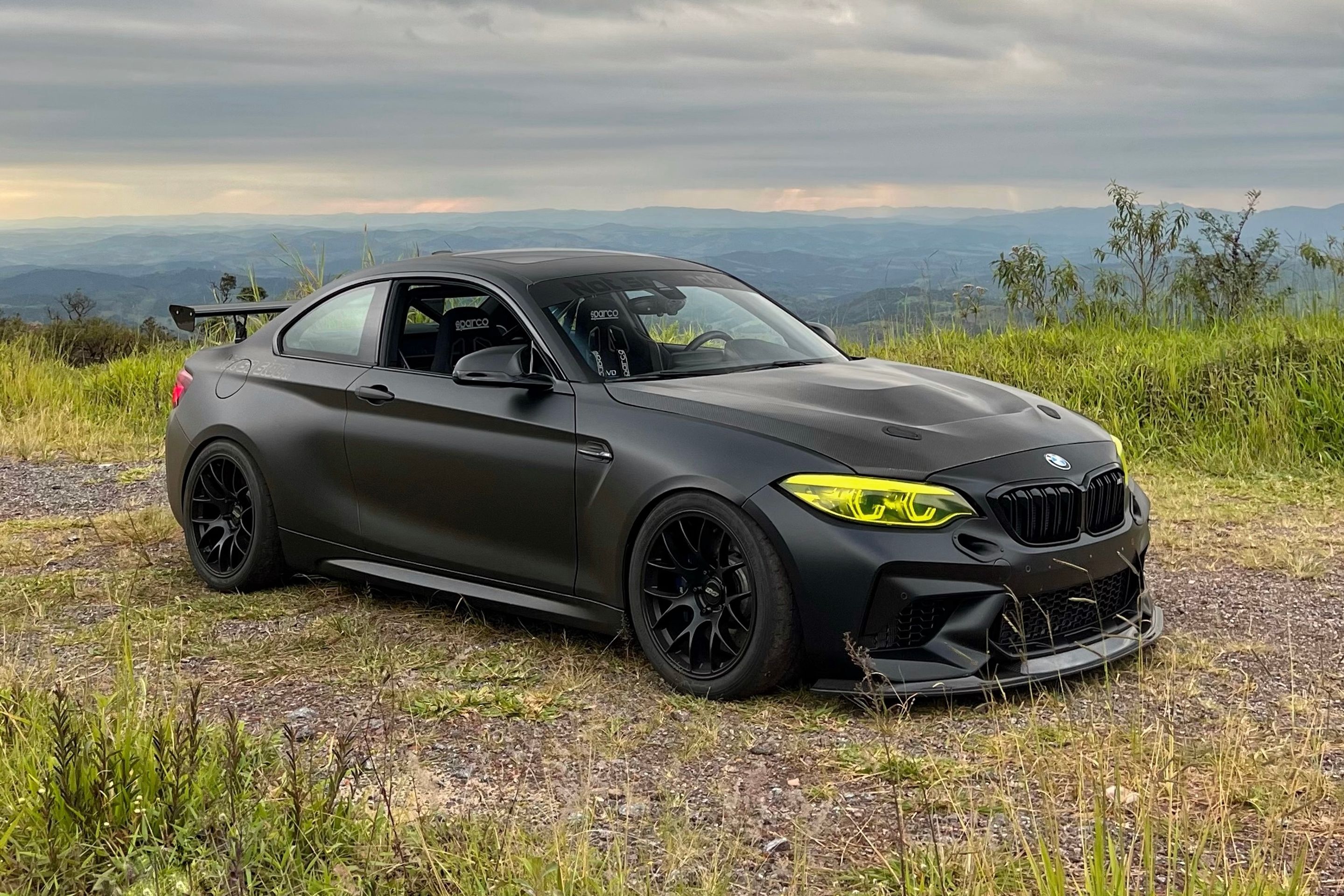 Black BMW F87 M2 with 18" EC-7 Apex wheels in Satin Black