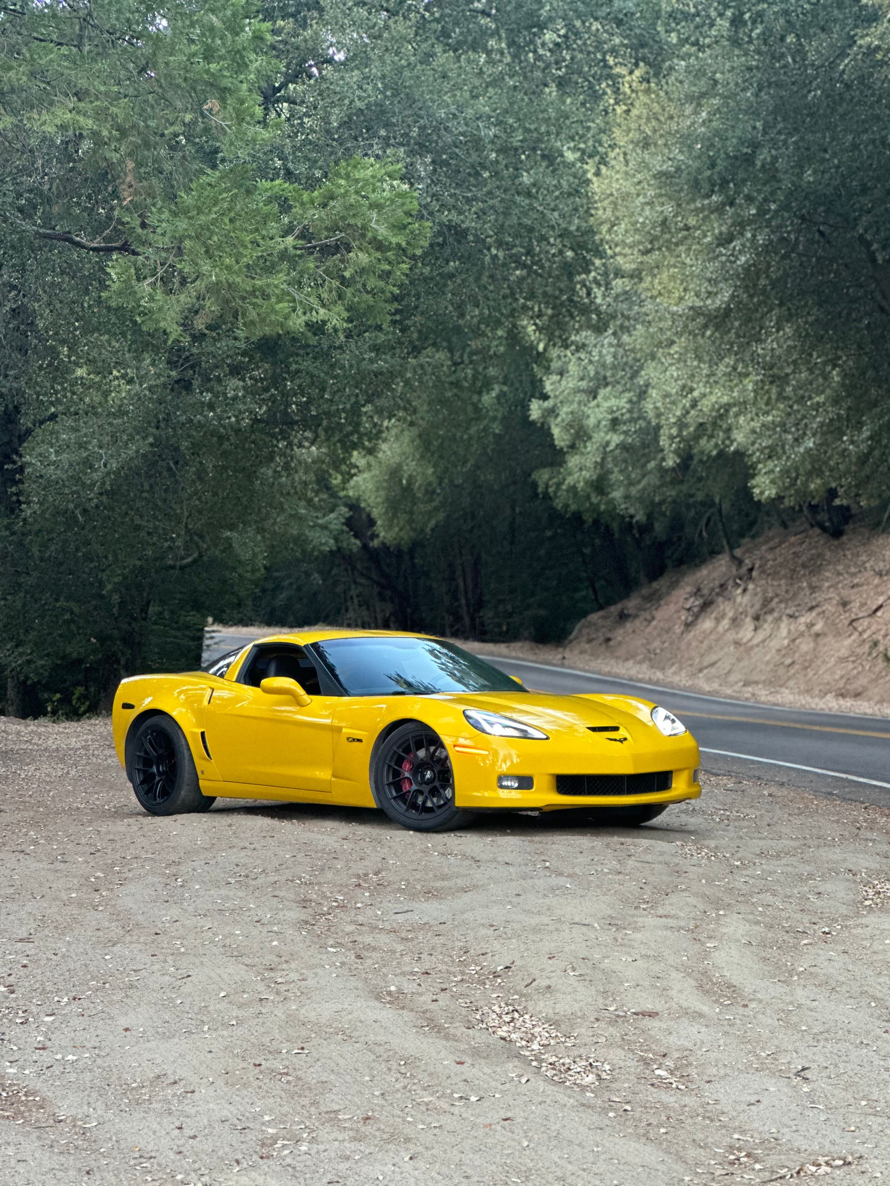 Yellow Chevrolet C6 Corvette Z06 with 19" EC-7RS Apex wheels in Satin Black