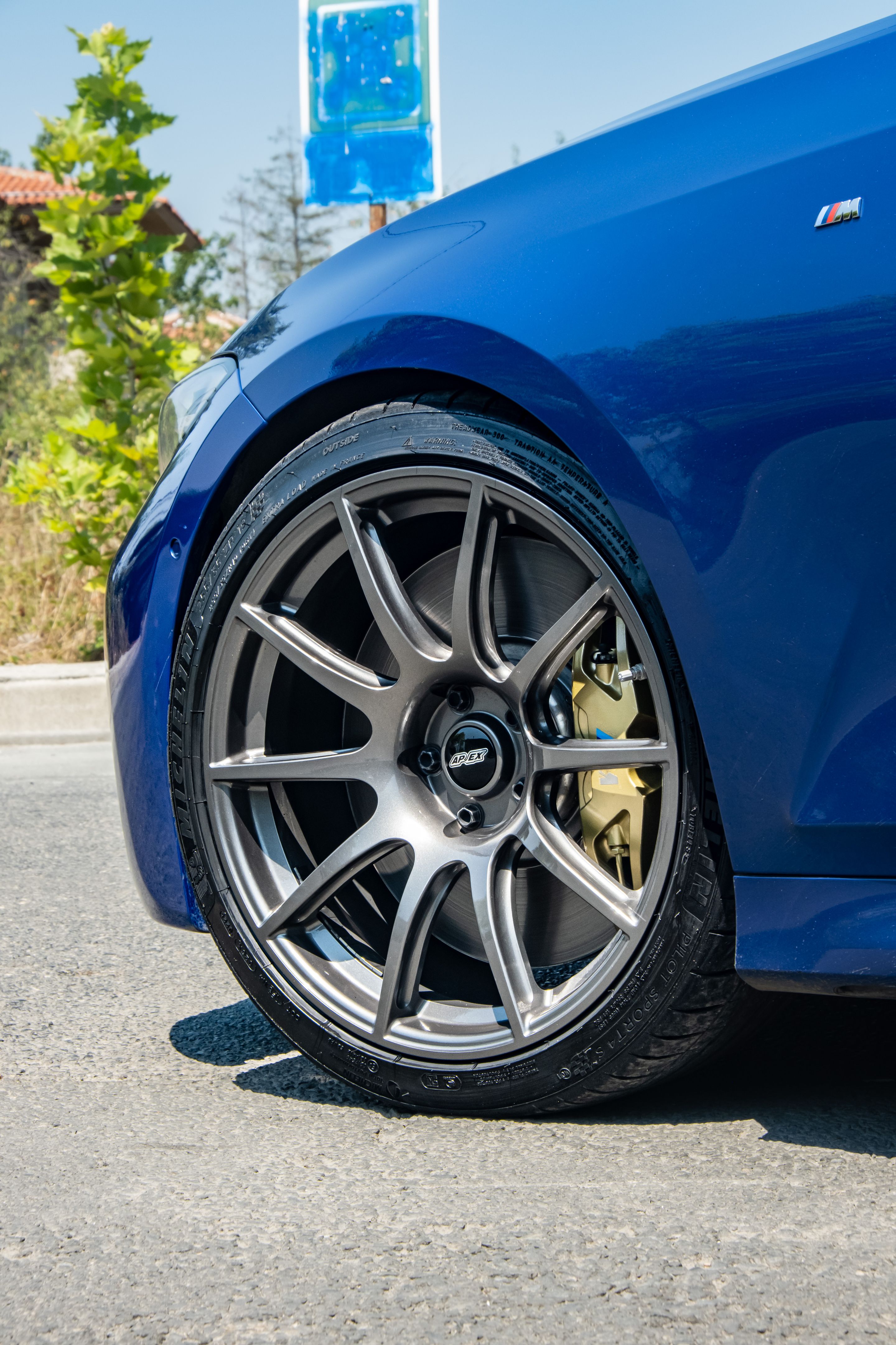 Blue BMW G20 Sedan 3 Series with 19" SM-10 Apex wheels in Anthracite