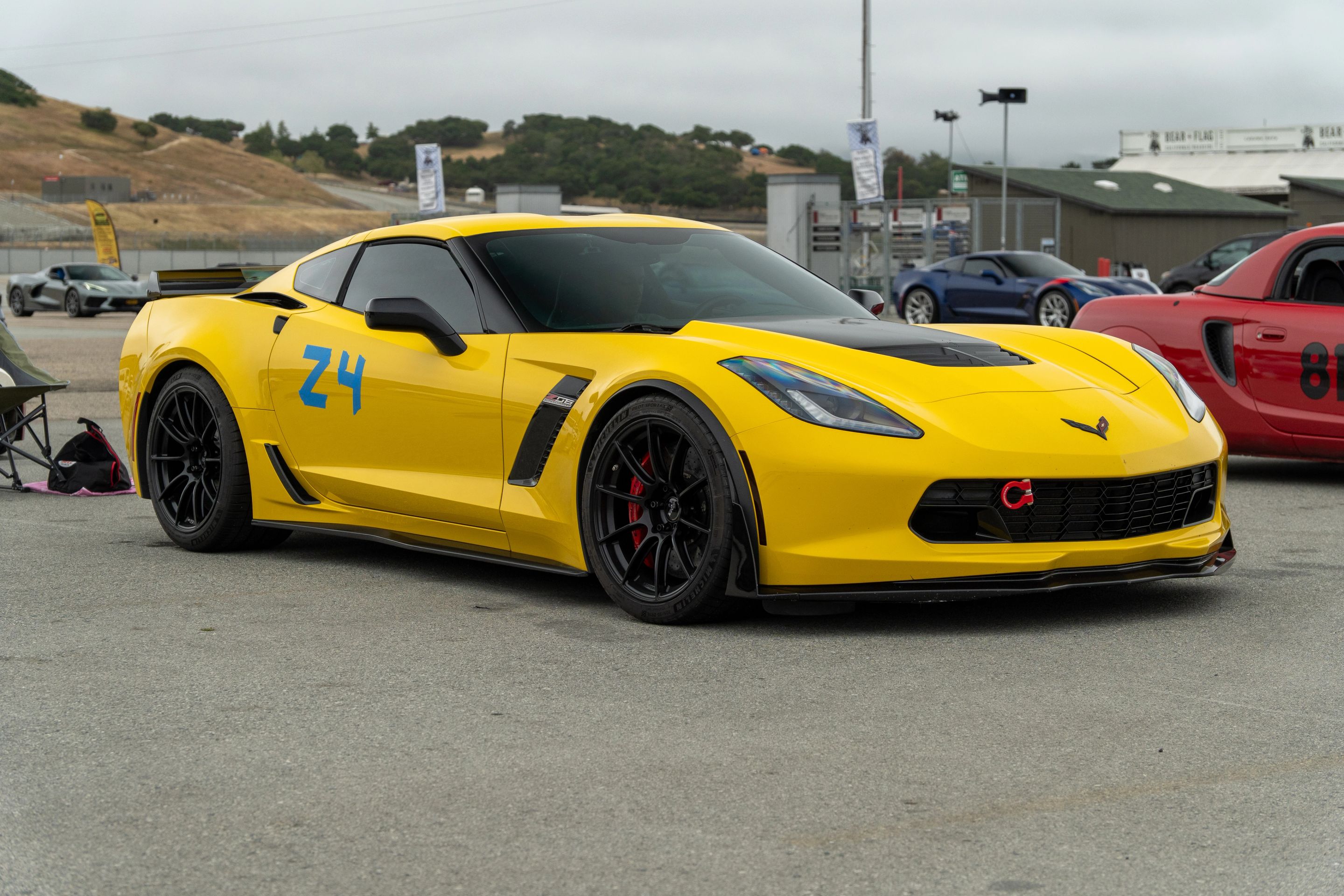 Yellow Chevrolet C7 Corvette Z06 with 19" SM-10RS Apex wheels in Satin Black