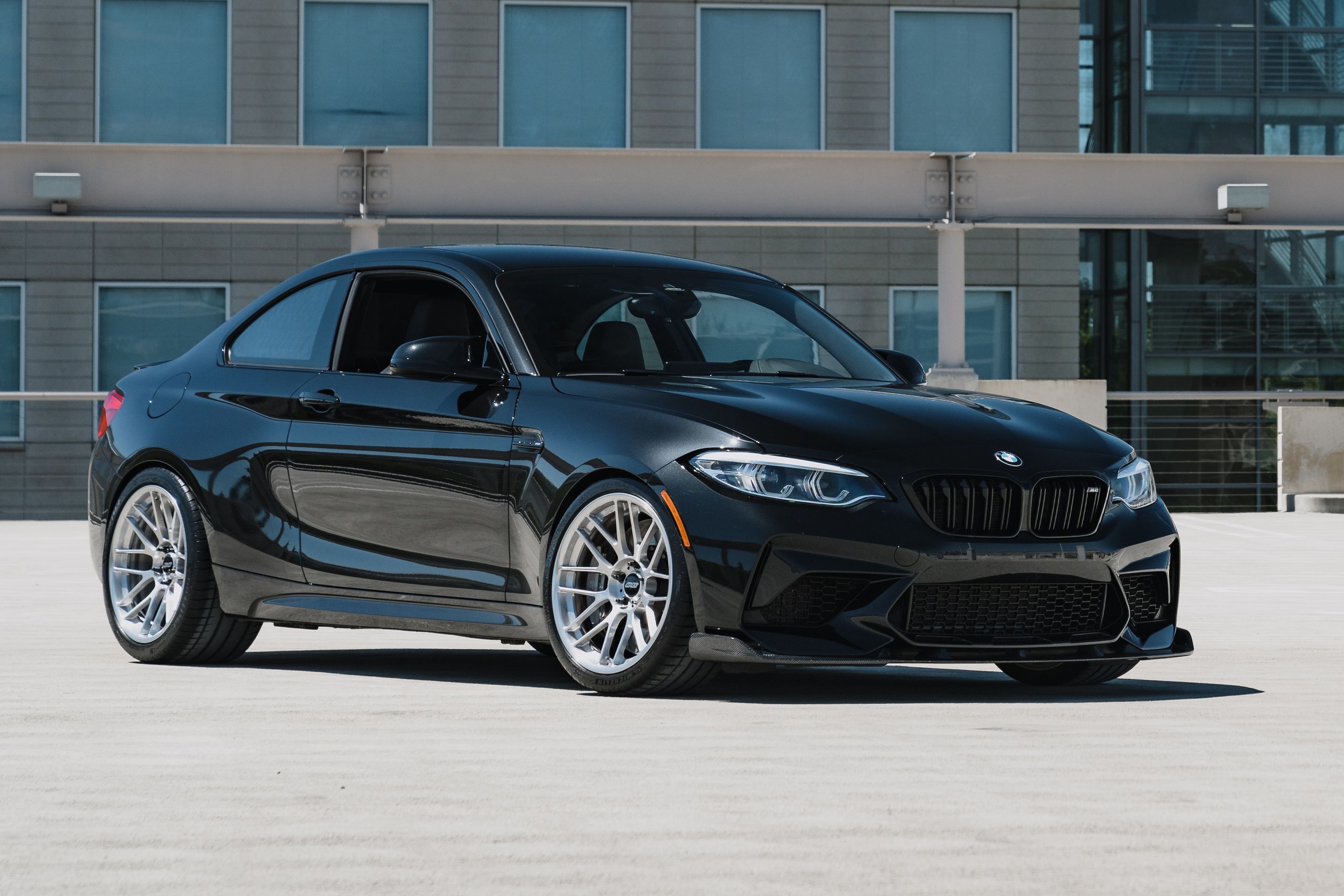 Black BMW F87 M2 with 19" ARC-8RT Apex wheels in Brushed Clear