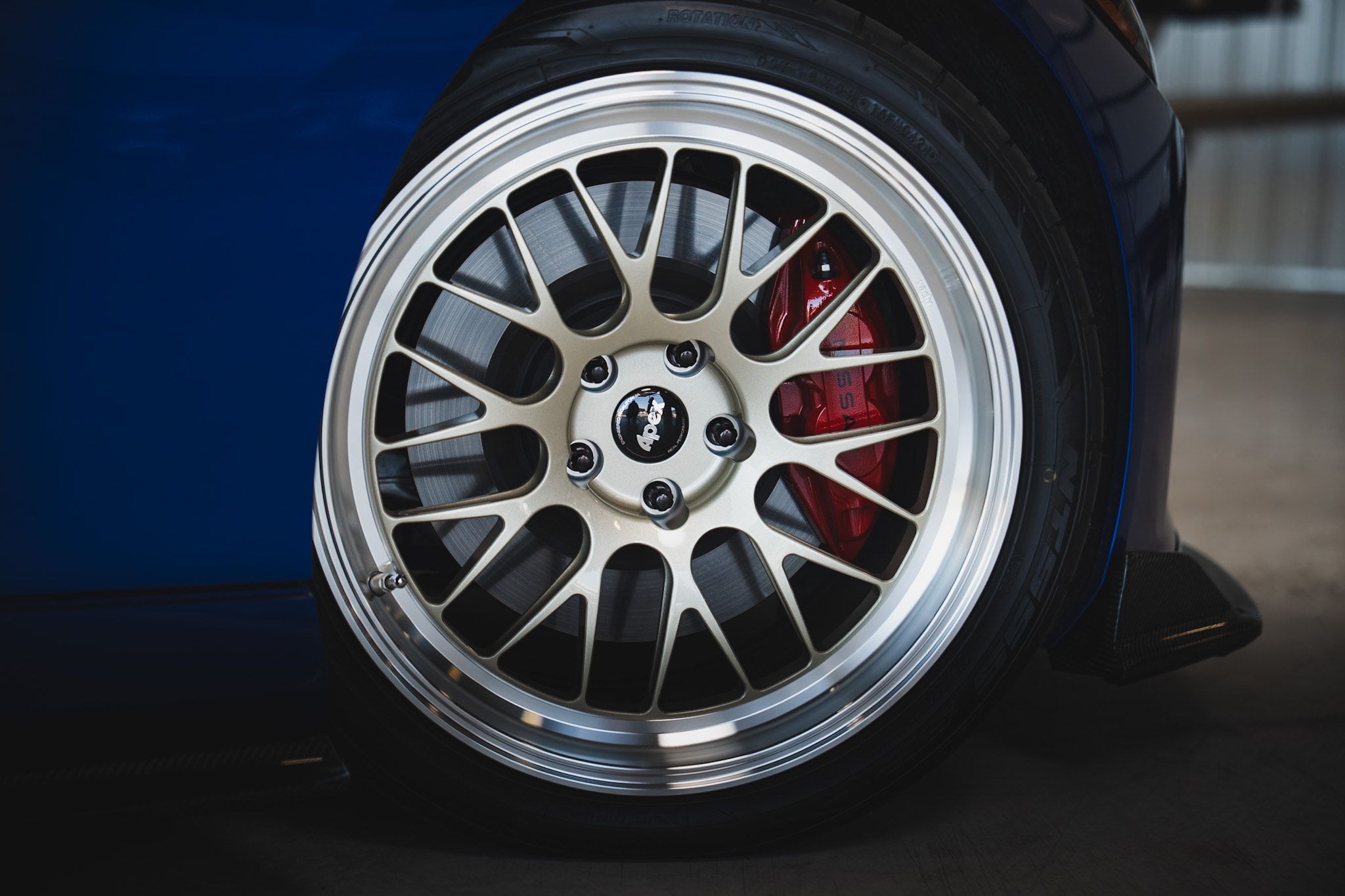 Blue Nissan Z with 19" ML-10RT Apex wheels in Machined Lip Gloss Motorsport Gold