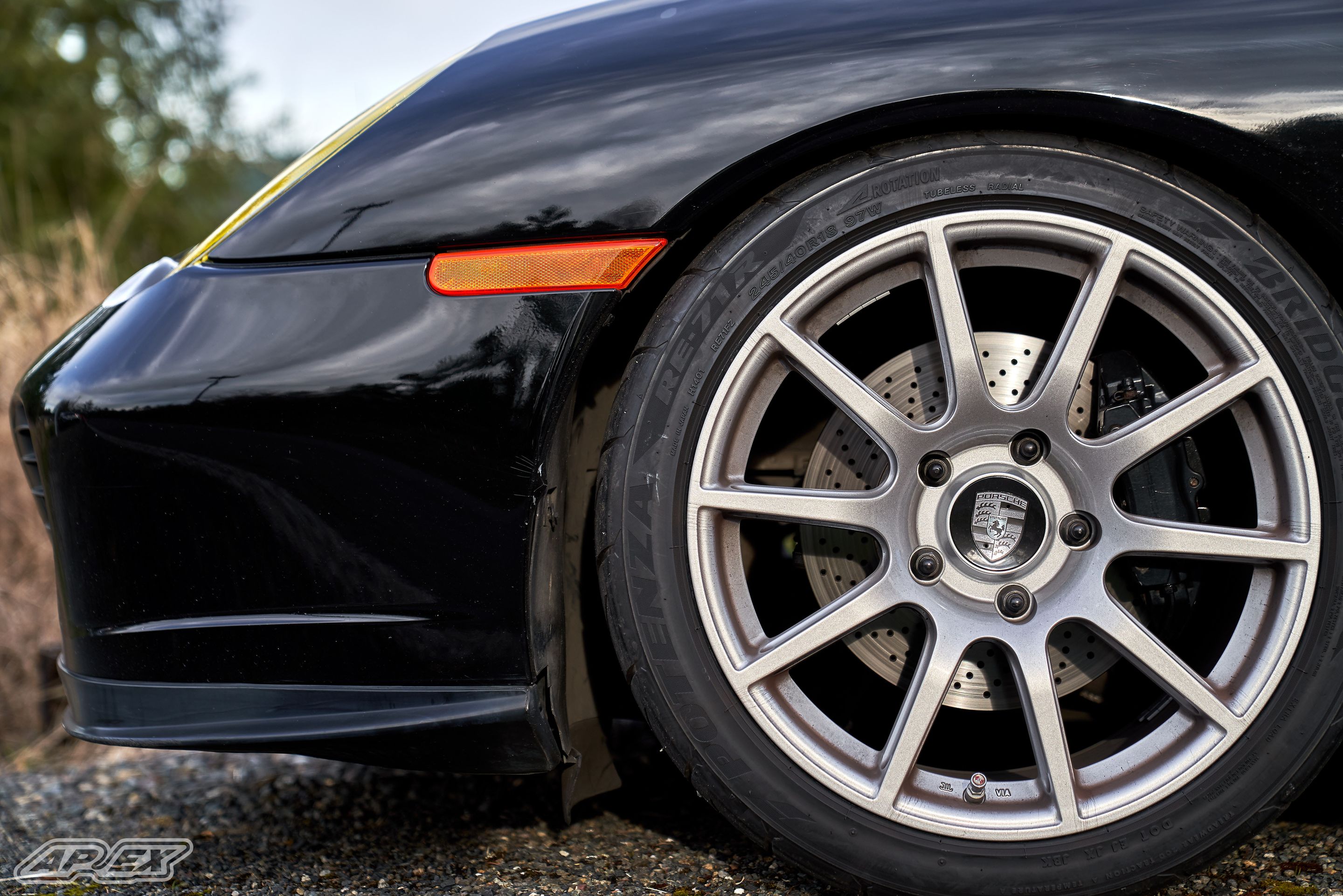 Black Porsche 911 996 Carrera with 18" SM-10 Apex wheels in Race Silver