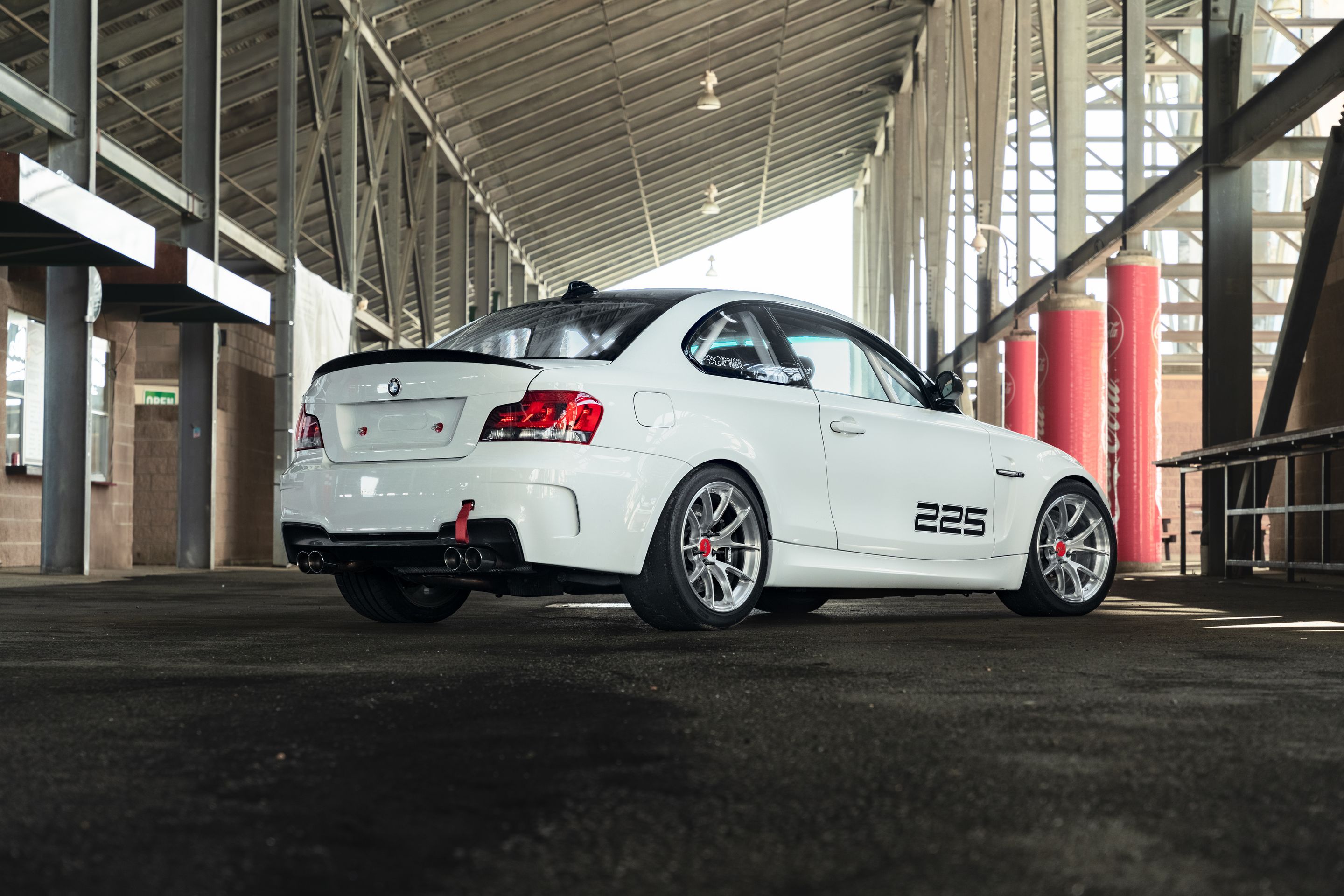 White BMW E82 1M with 18" VS-5RS Apex wheels in Brushed Clear